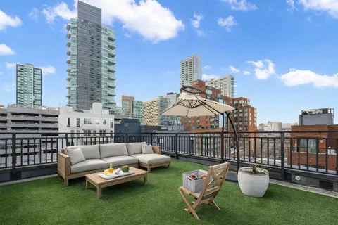 a view of a patio with couches and a table and chairs