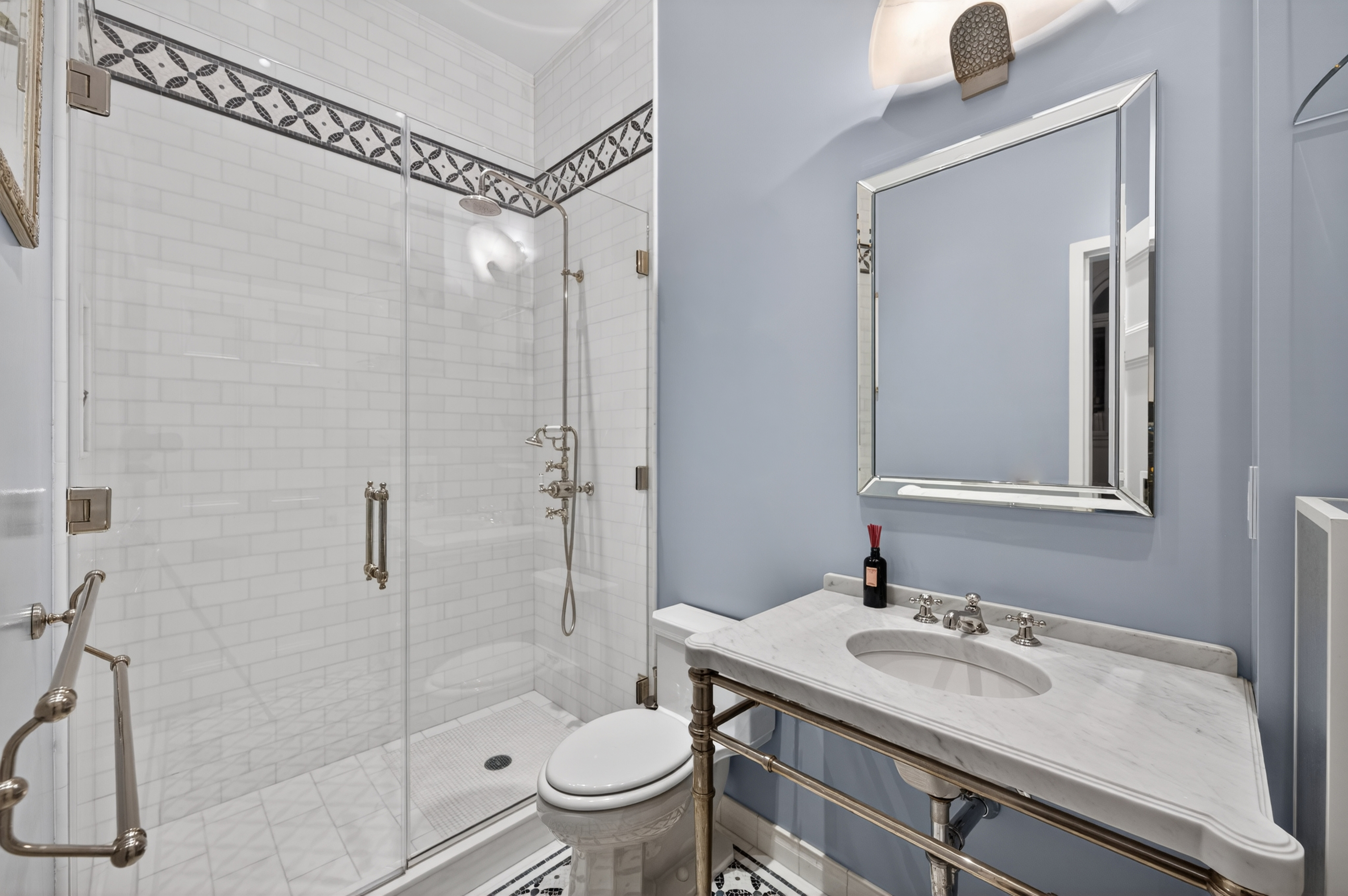 390 West End Avenue, Unit 11C Manhattan, NY 10024 - Photo 14 of 24 a bathroom with a sink toilet vanity and shower