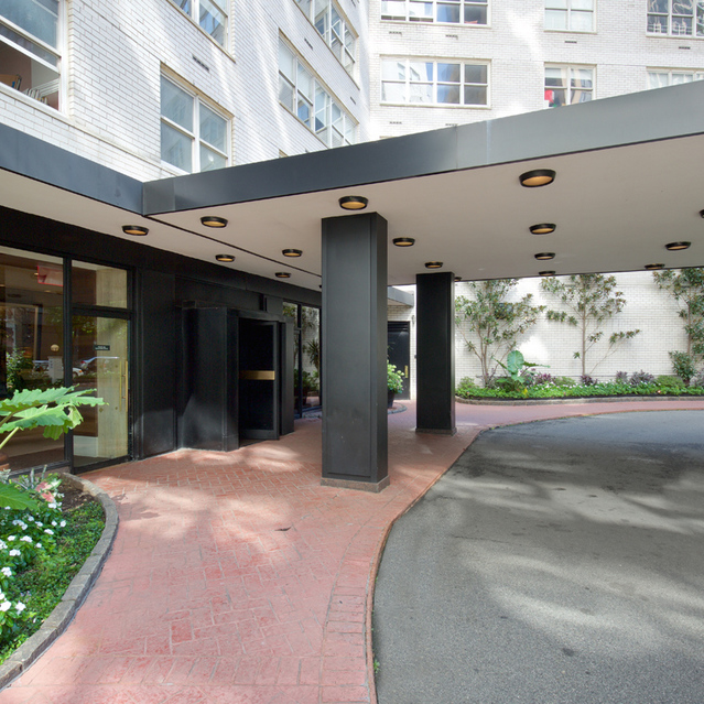 155 West 68th Street, Unit 1907 Manhattan, NY 10023 - Photo 19 of 20 a front view of a building with a garden