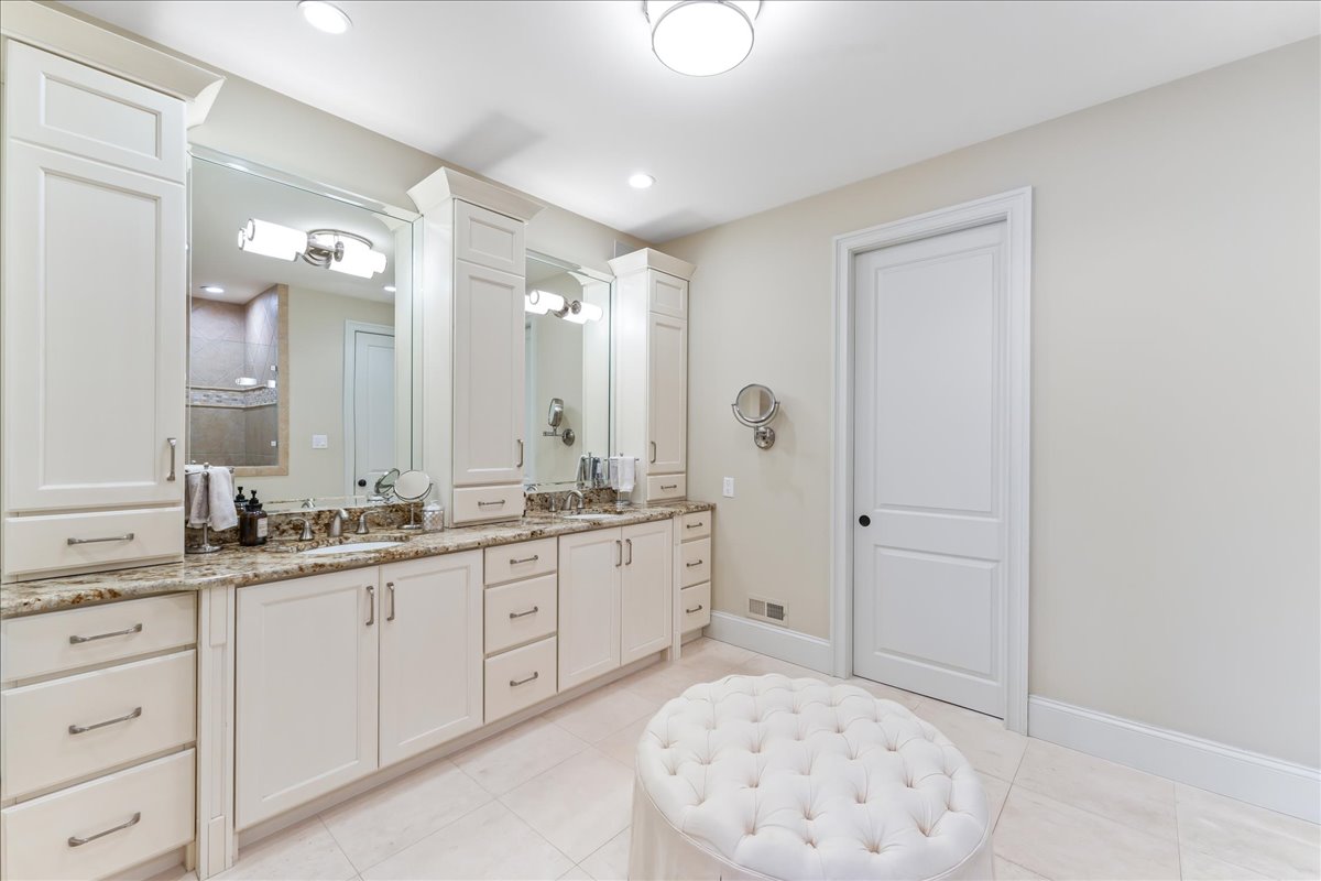 248 Valley Ridge Road Haverford, PA 19041 - Photo 22 of 44 a spacious bathroom with a granite countertop sink a mirror and a