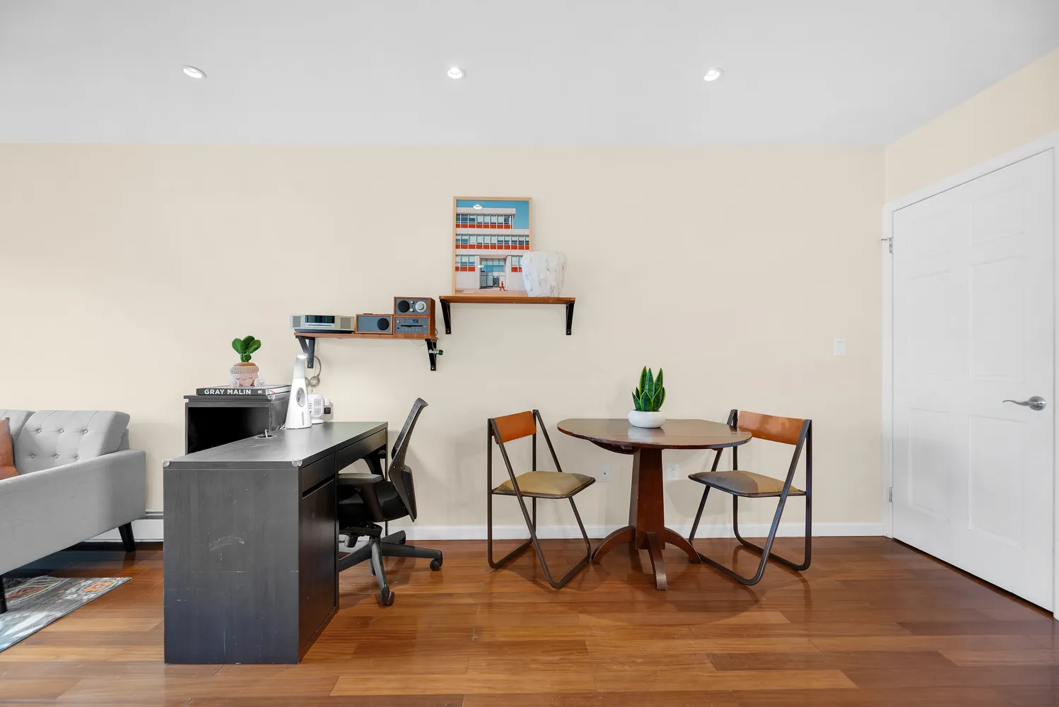 a view of a workspace with furniture and lounge chair