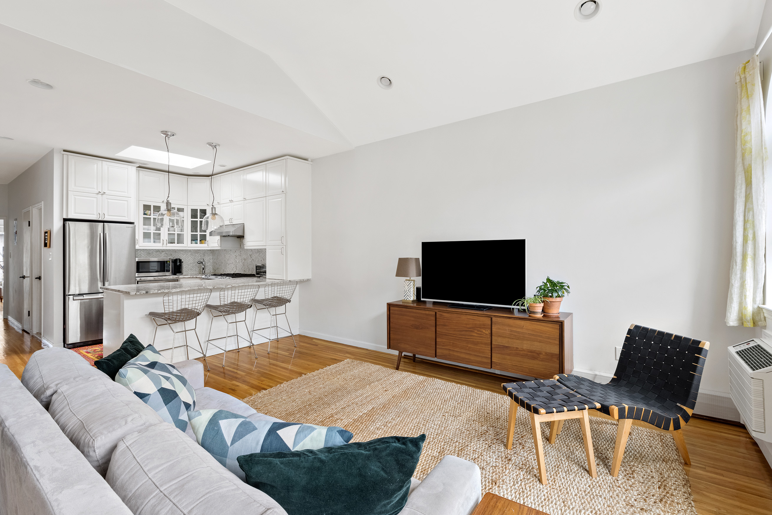 454 12th Street, Unit 3 Brooklyn, NY 11215 - Photo 2 of 18 a living room with furniture and a flat screen tv
