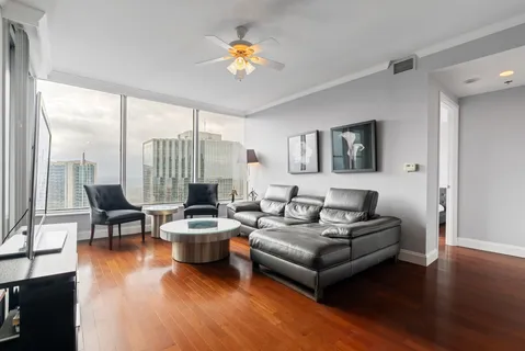 a bathroom with a granite countertop sink a toilet and a mirror