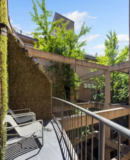 a view of a balcony with wooden floor