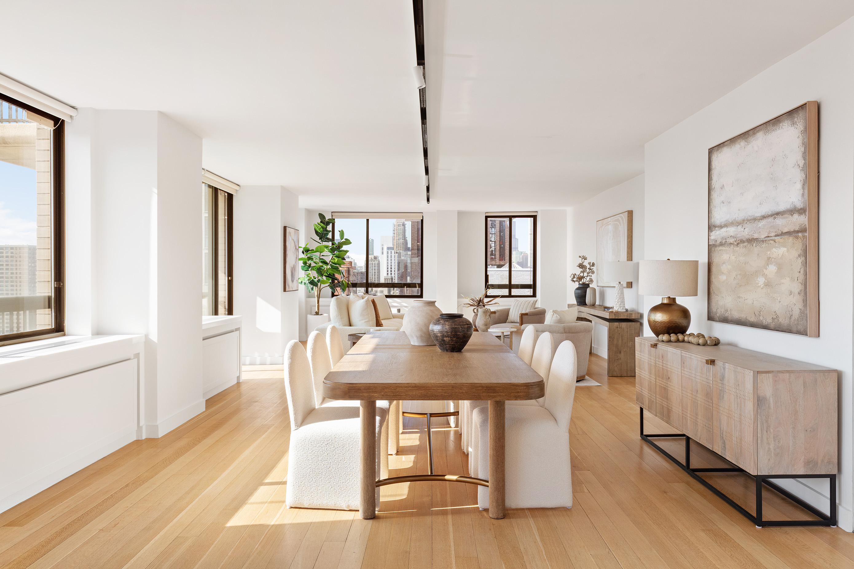 171 East 84th Street, Unit 25B/C Manhattan, NY 10028 - Photo 3 of 13 a view of a dining room with furniture window and wooden floor