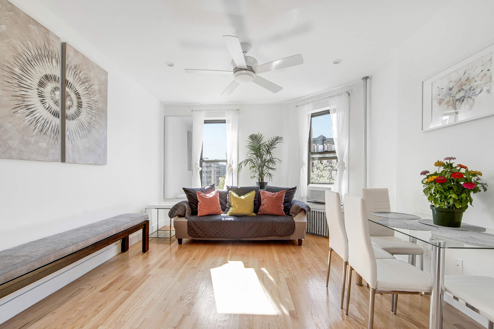 1878 Adam Clayton Powell Jr Boulevard, Unit 52 Manhattan, NY 10026 - Photo 2 of 13 a living room with furniture and flowers
