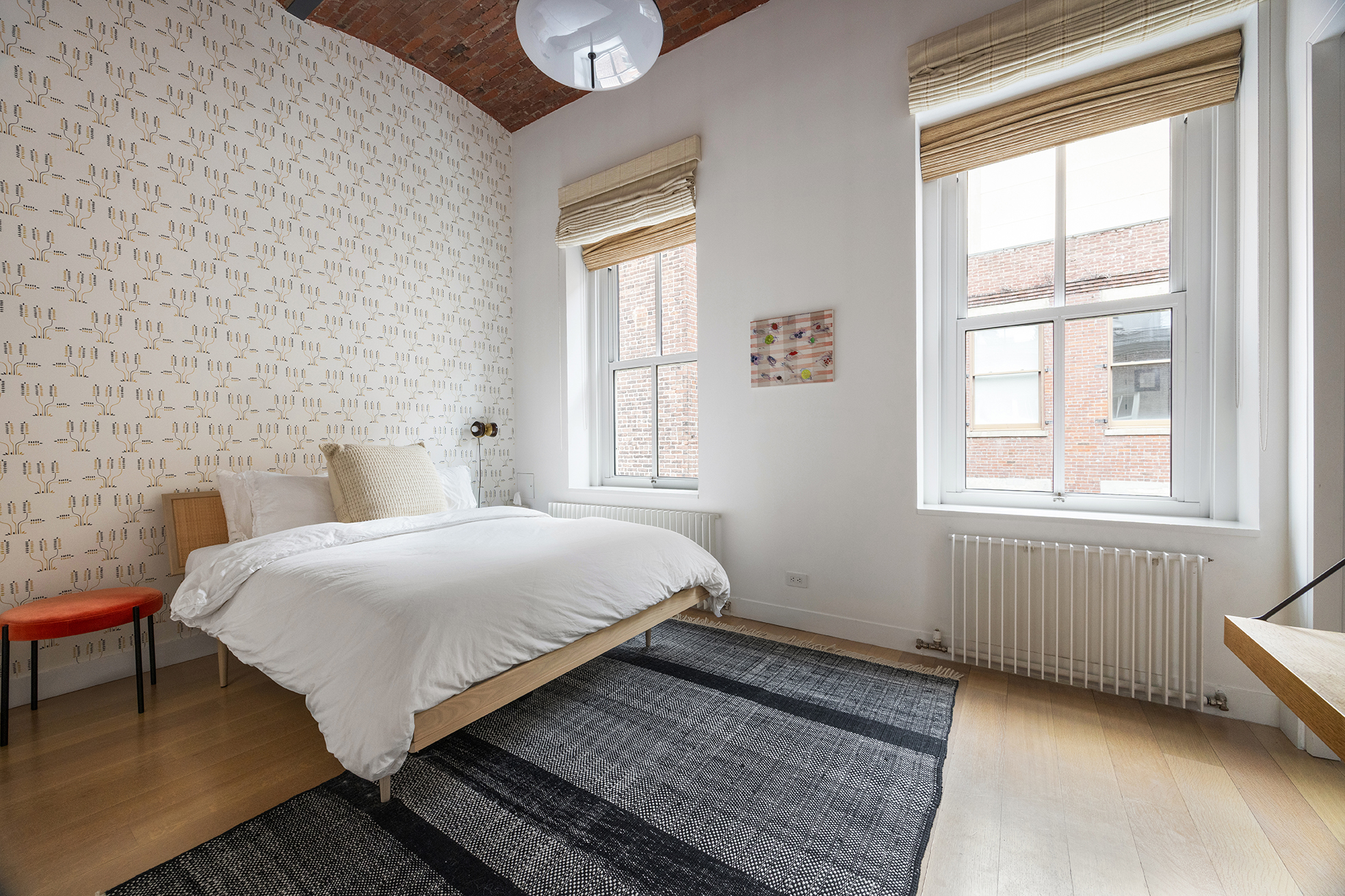 63 Greene Street, Unit PHB Manhattan, NY 10012 - Photo 15 of 17 a bedroom with a bed and a window