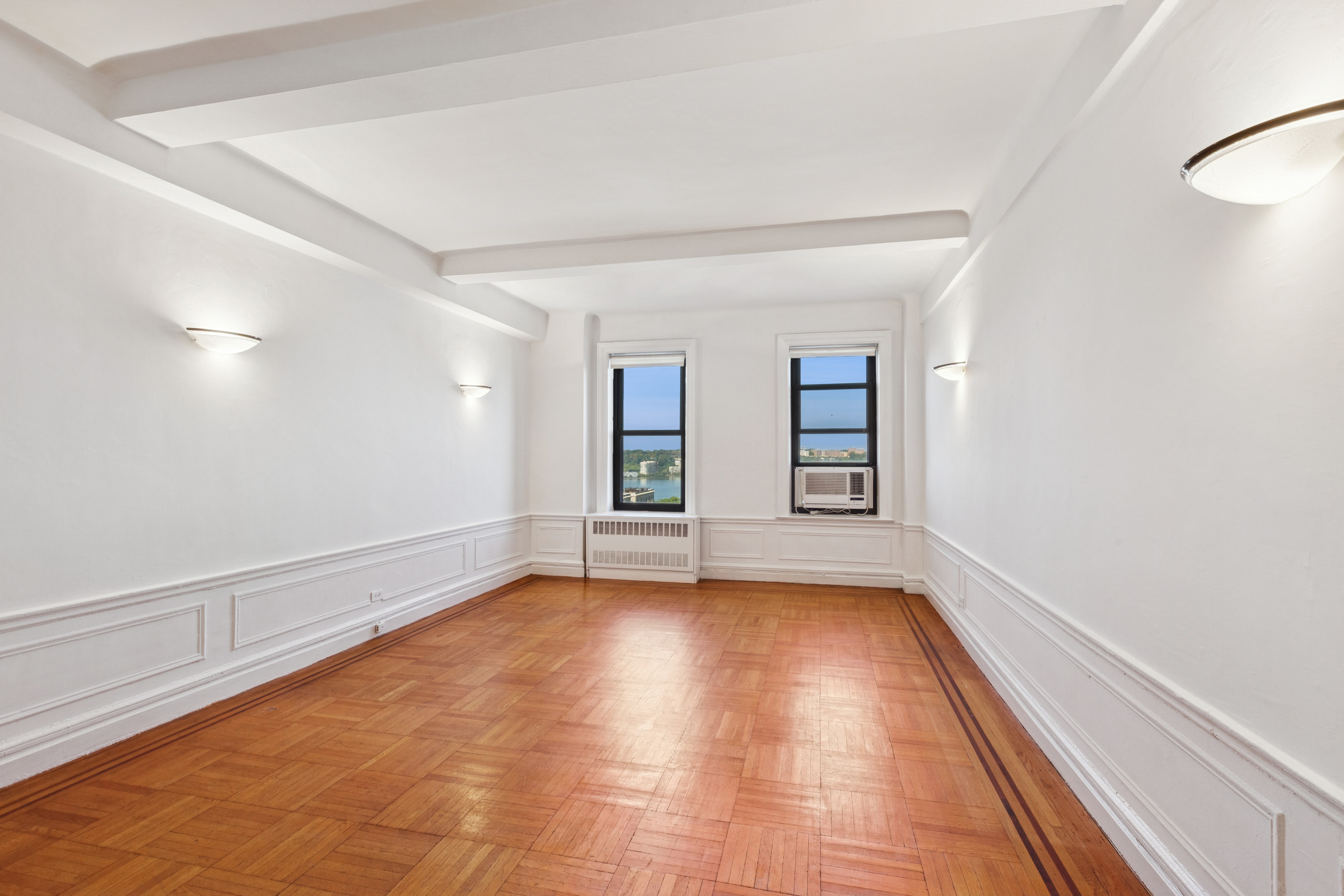 710 West End Avenue, Unit 14B Manhattan, NY 10025 - Photo 2 of 19 wooden floor in an empty room with a window