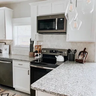 a kitchen with a stove and a microwave