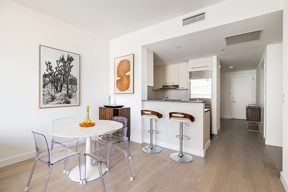 255 Hudson Street, Unit 7C Manhattan, NY 10013 - Photo 4 of 9 a dining room with a table and chairs
