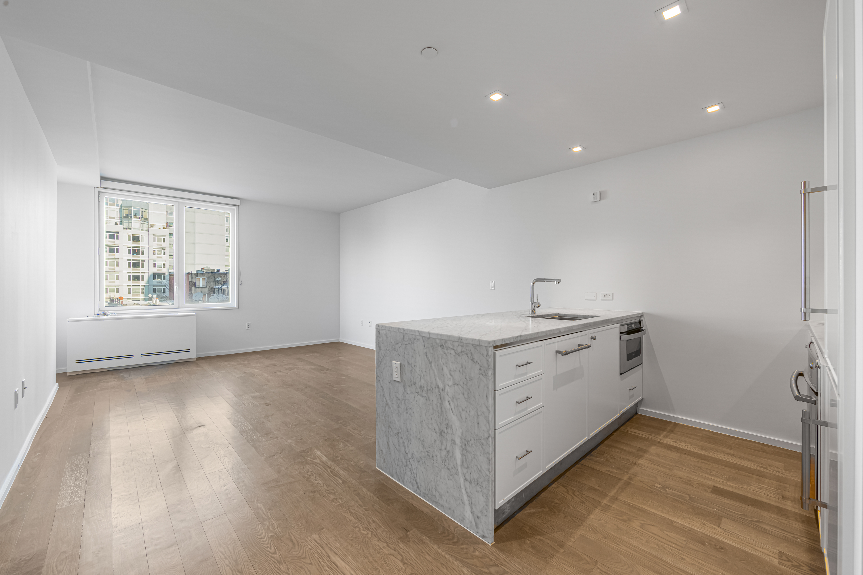 202 8th Street, Unit 4E Brooklyn, NY 11215 - Photo 4 of 19 a kitchen with a sink cabinets and wooden floor