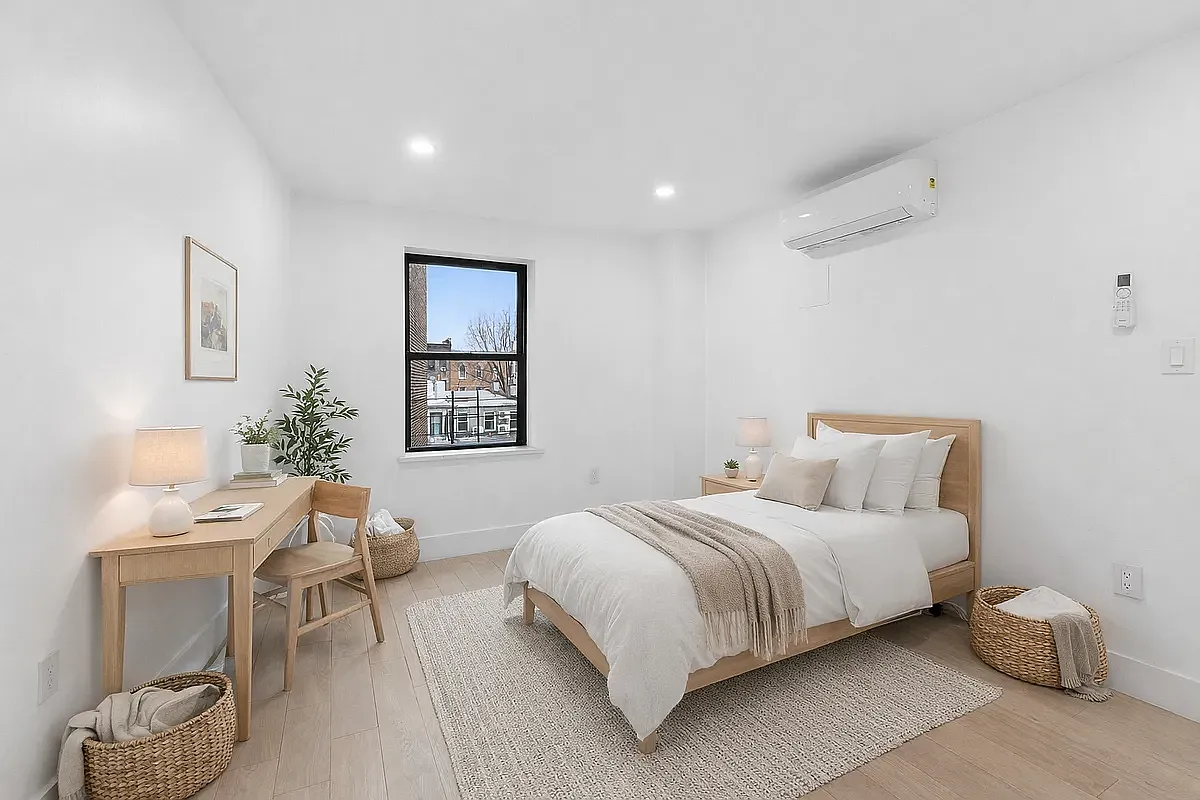 452 Dean Street, Unit 2F Brooklyn, NY 11217 - Photo 6 of 8 a bedroom with a bed and a table