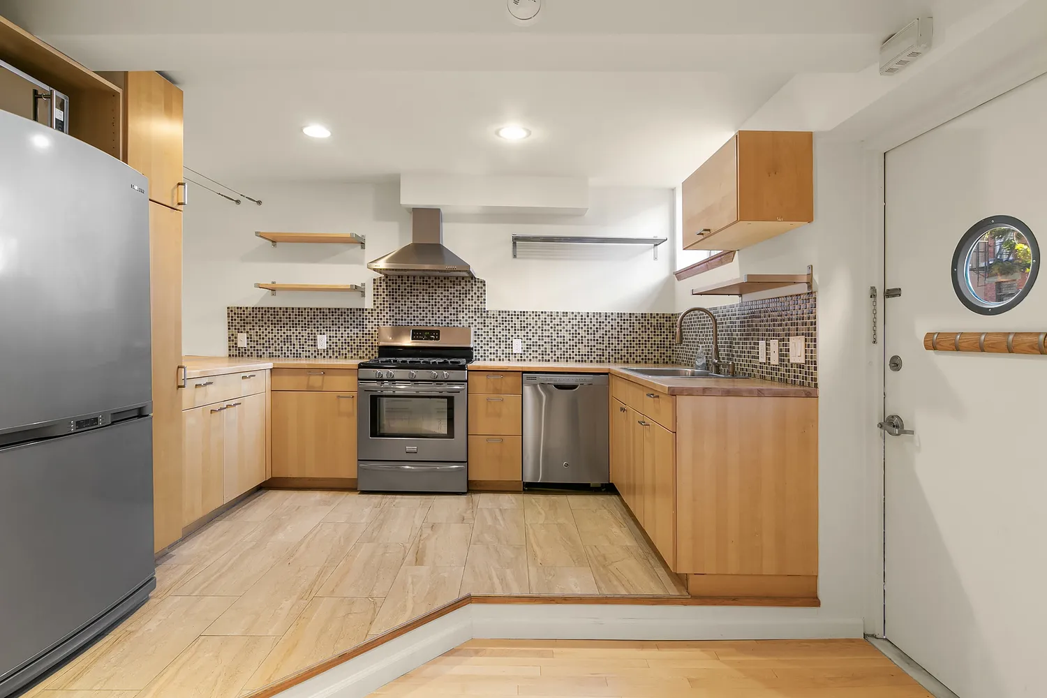 a kitchen with a white cabinets and white appliances