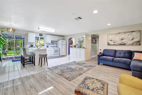 a kitchen with a refrigerator and a sink
