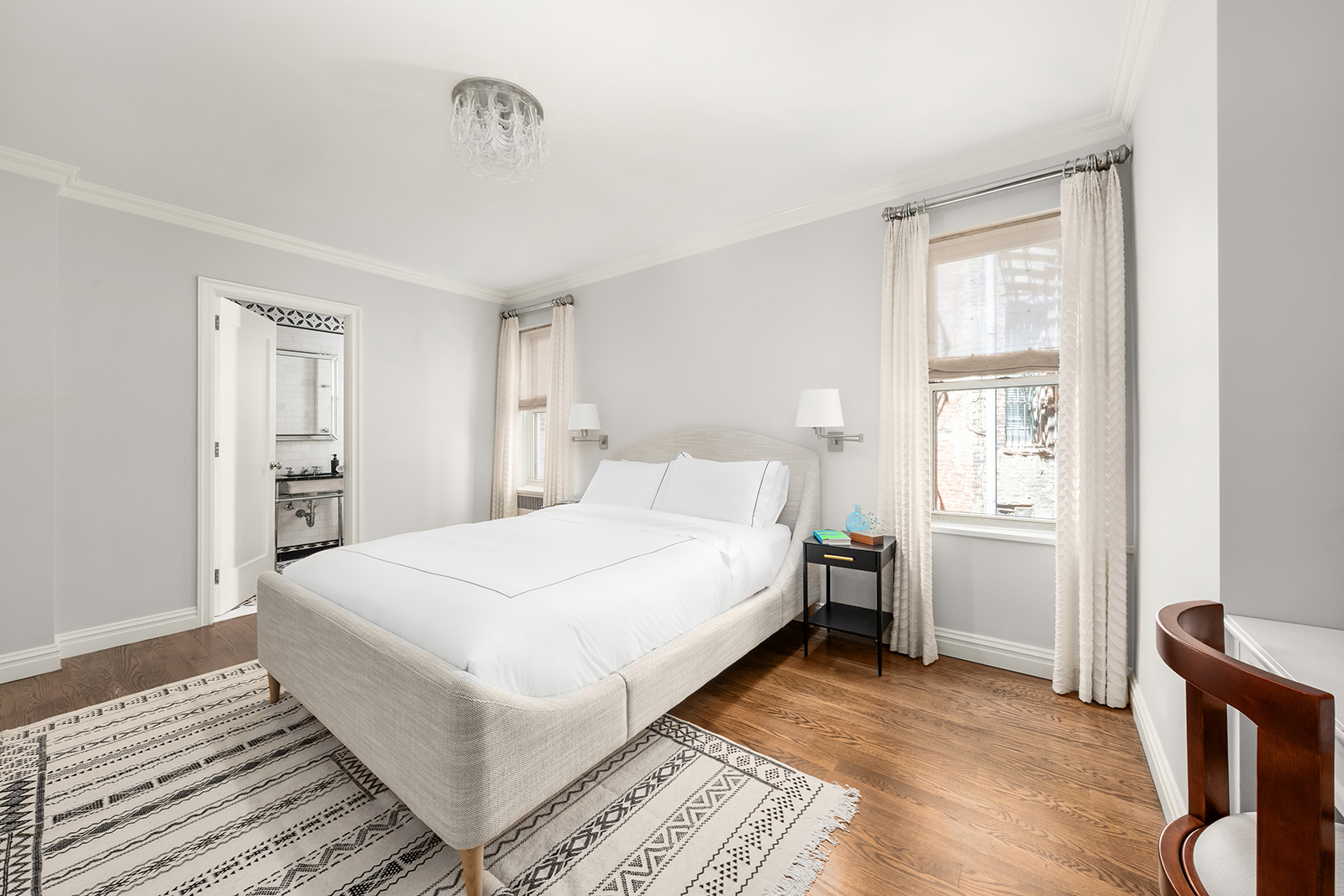 75 Bank Street, Unit 2H Manhattan, NY 10014 - Photo 10 of 18 a bedroom with a bed and a window