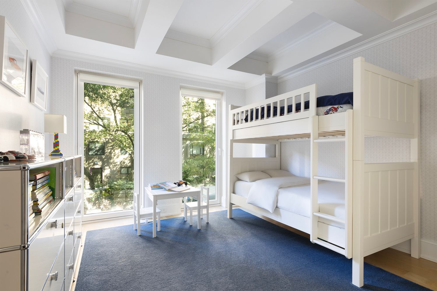 554 East 82nd Street, Unit 1/2 Manhattan, NY 10028 - Photo 6 of 13 a bedroom with a bed and a large window with the outer view