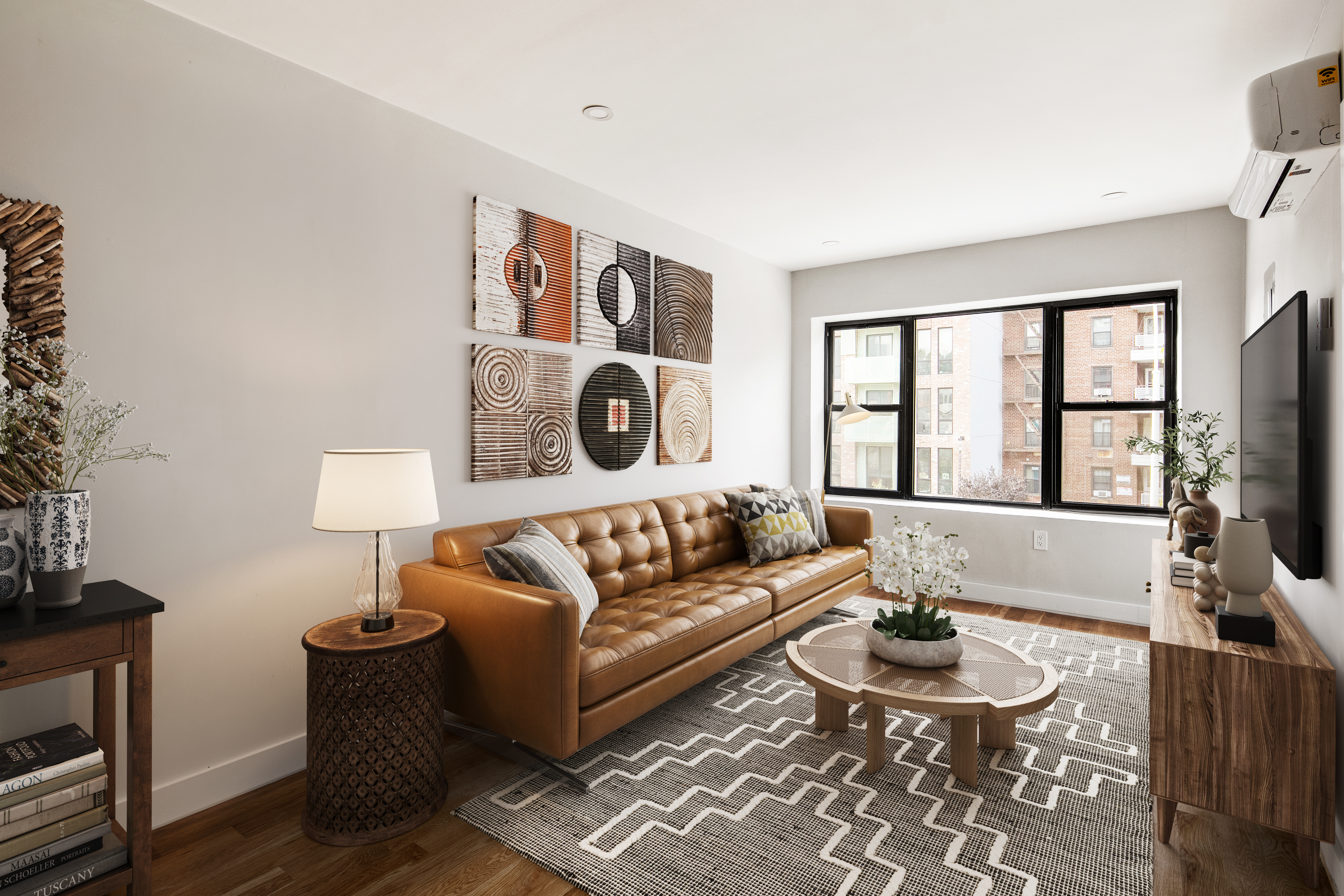 405 Herkimer Street, Unit 3 Brooklyn, NY 11213 - Photo 2 of 8 a living room with furniture and a flat screen tv