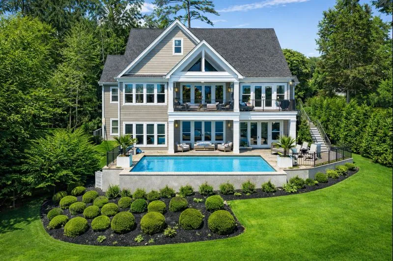 a front view of house with yard and outdoor seating