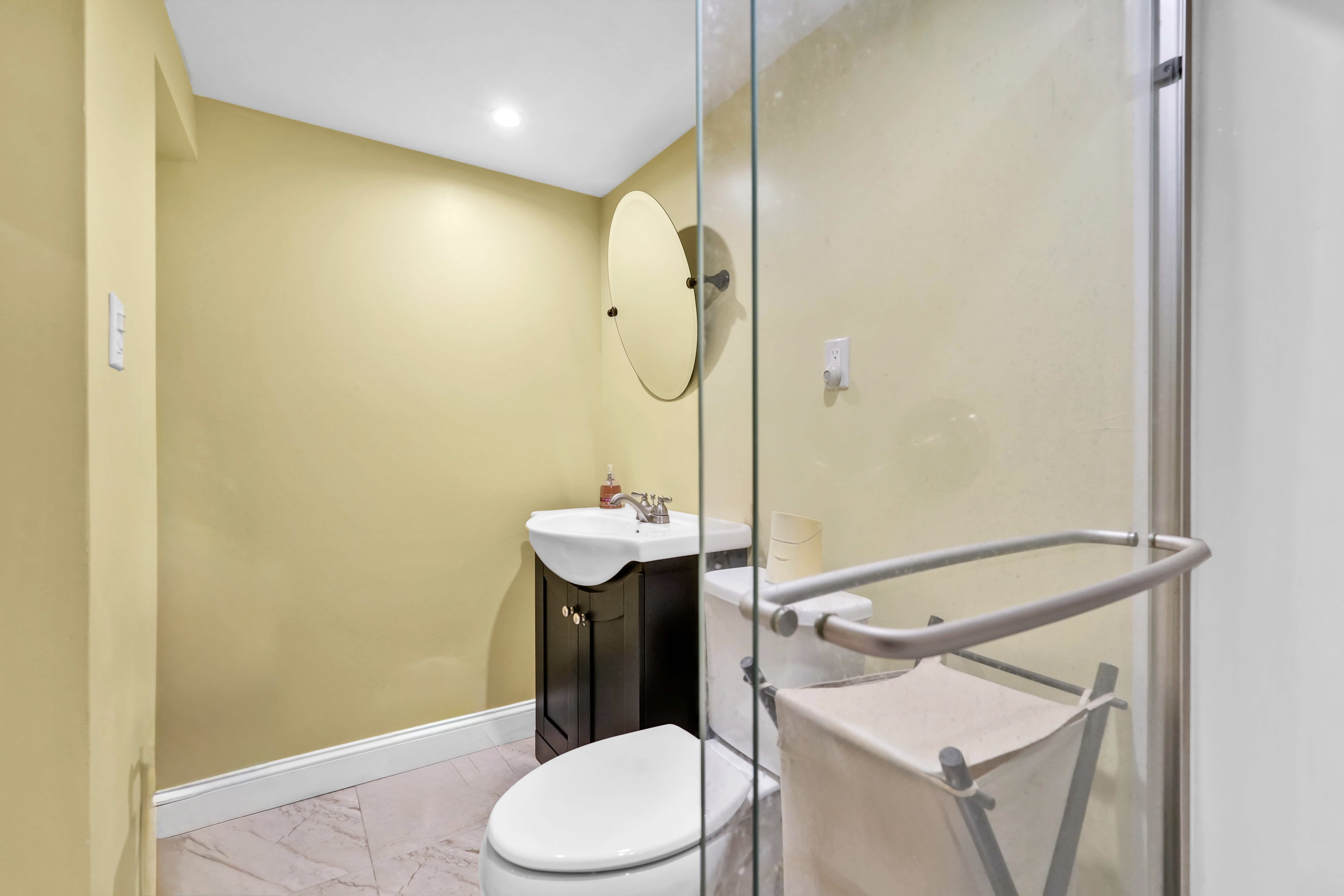 519 Monroe Street Brooklyn, NY 11221 - Photo 52 of 55 a bathroom with a sink a toilet and shower