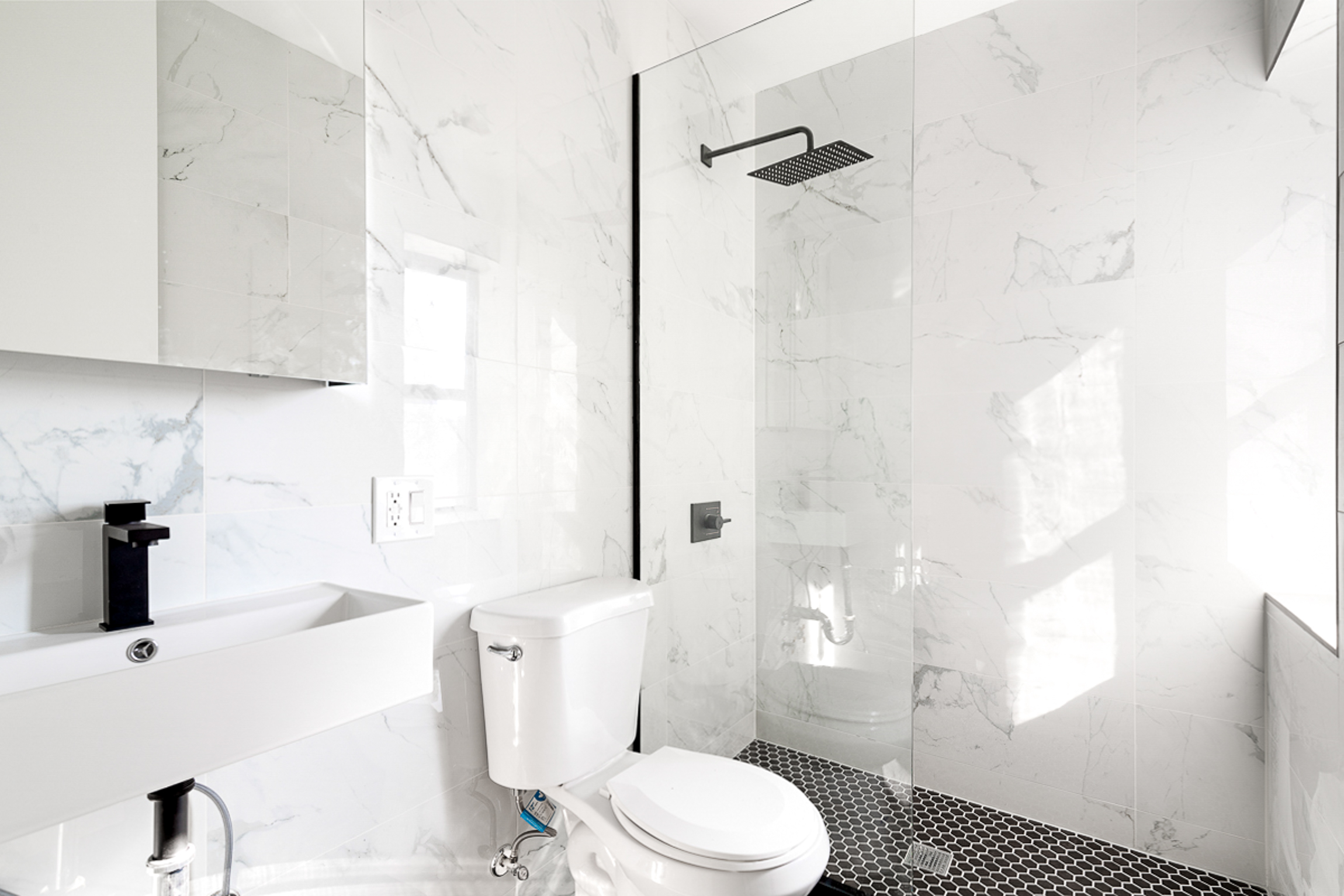 625 Park Place, Unit 3A Brooklyn, NY 11238 - Photo 5 of 9 a bathroom with a sink a toilet and shower