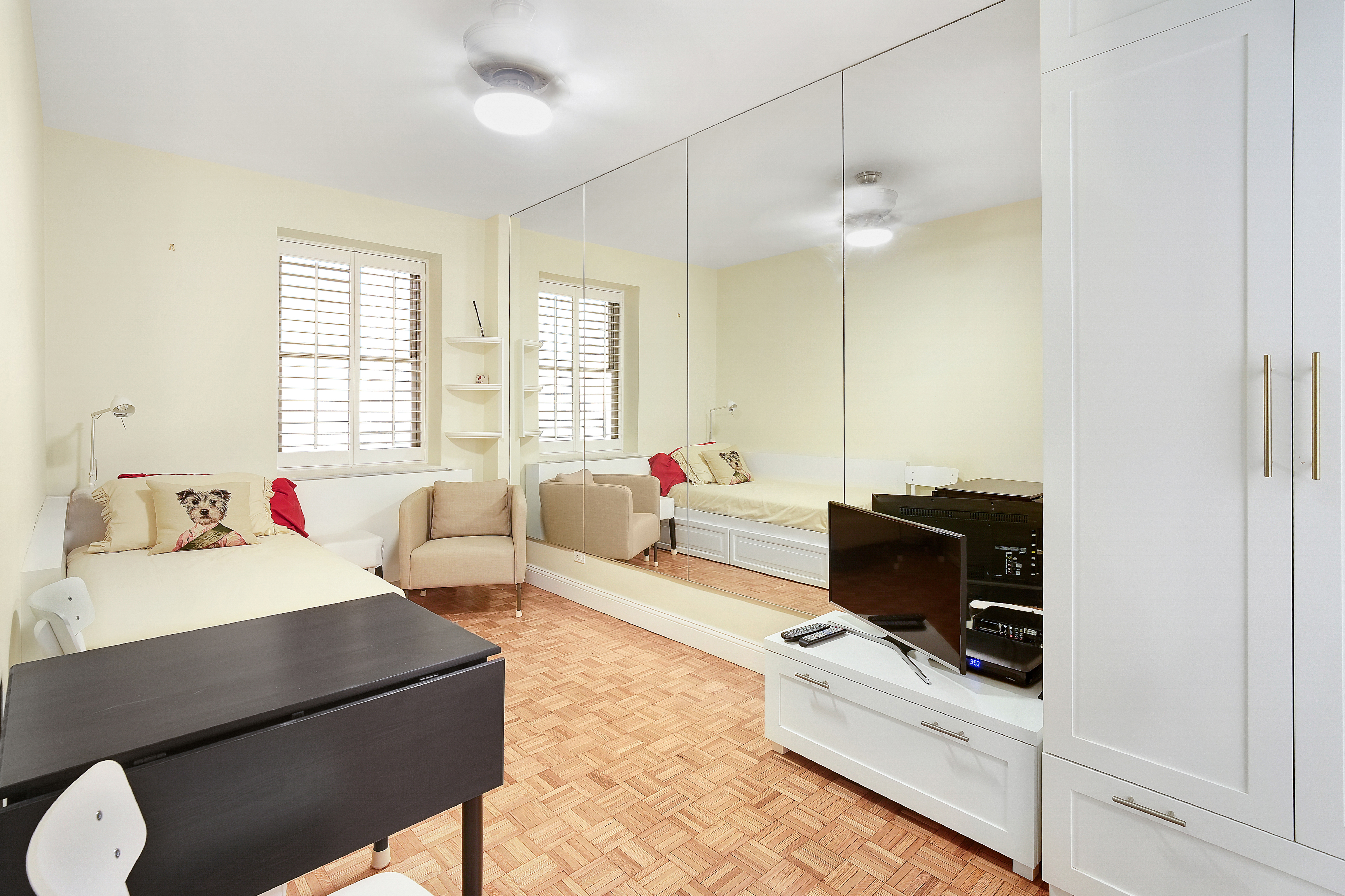 475 Park Avenue, Unit 3D5 Manhattan, NY 10022 - Photo 8 of 18 a living room with furniture a flat screen tv and a window