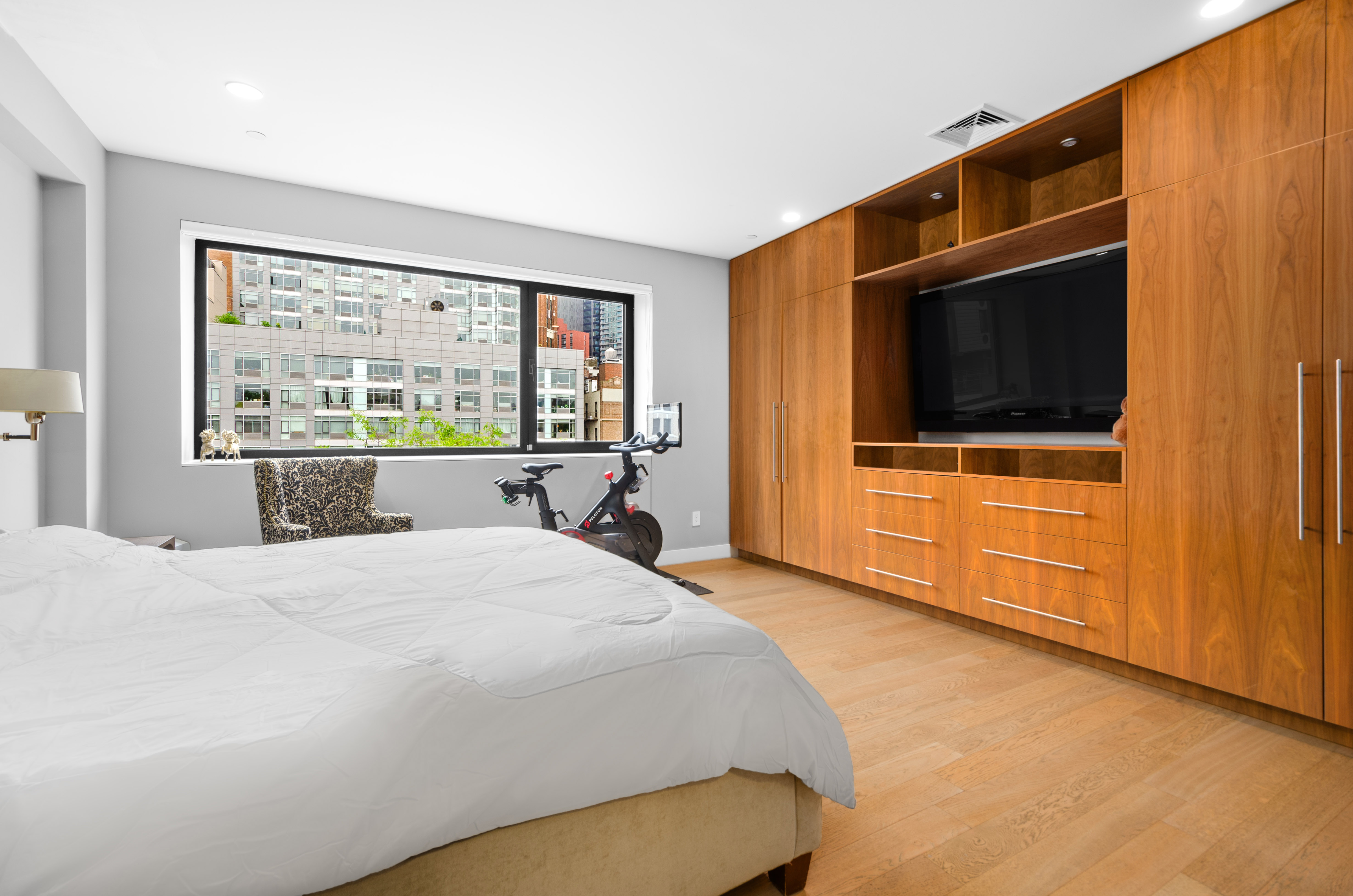 301 State Street Brooklyn, NY 11201 - Photo 9 of 14 a bedroom with a bed and a flat screen tv