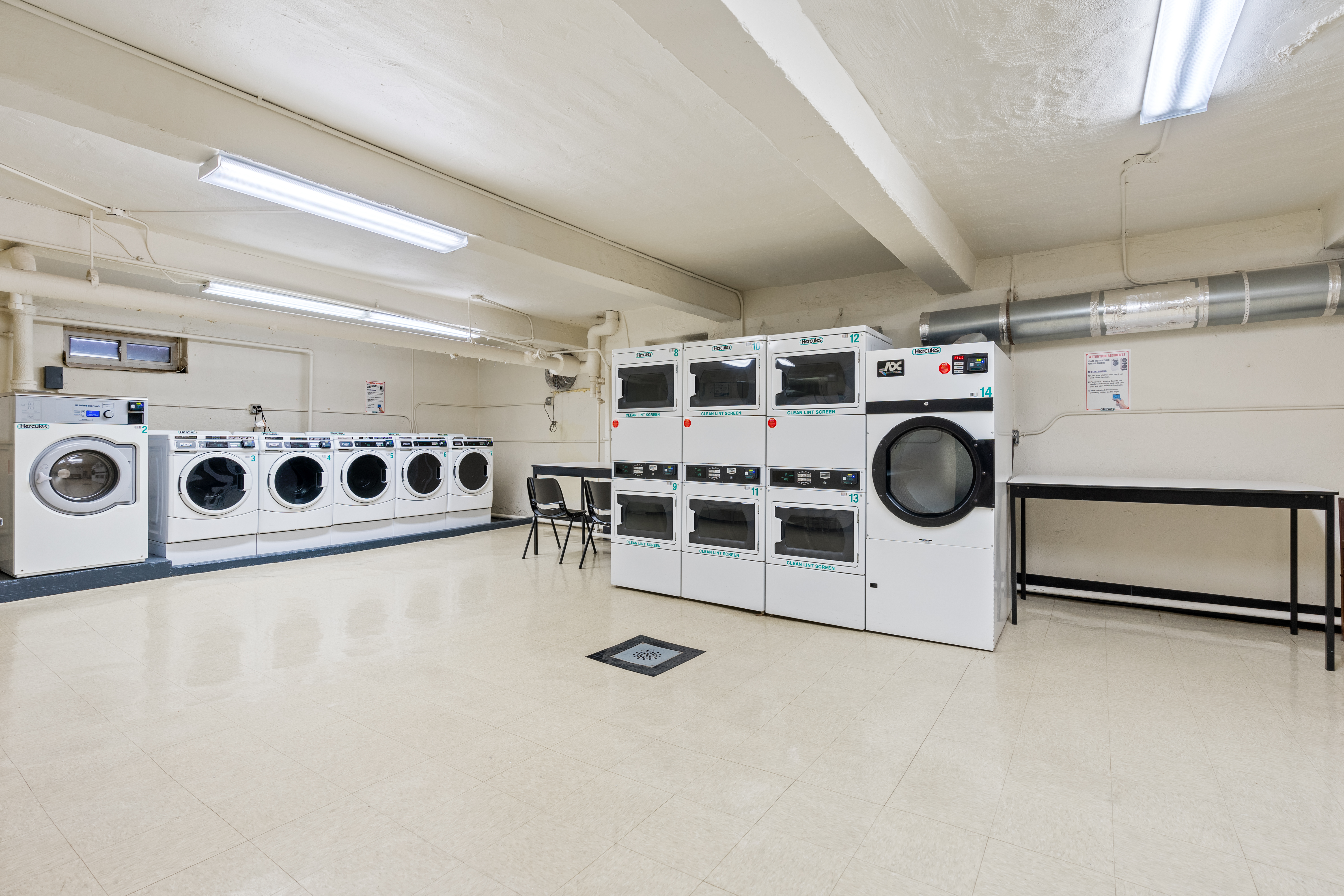 68-63 108th Street, Unit 1B Queens, NY 11375 - Photo 10 of 13 a utility room with stainless steel appliances cabinets and utility room view