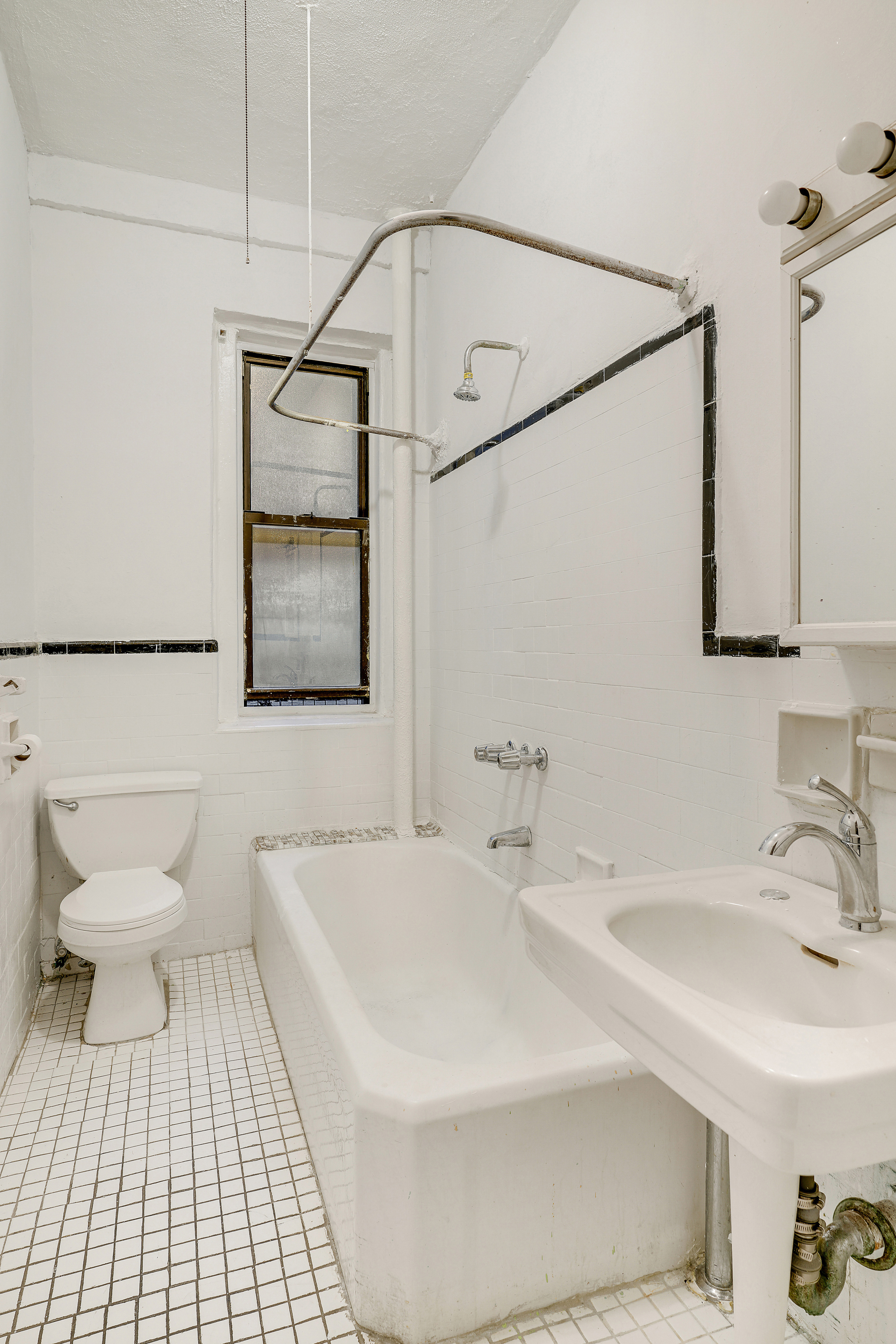 544 West 157th Street, Unit 44 Manhattan, NY 10032 - Photo 5 of 9 a bathroom with a sink toilet and shower