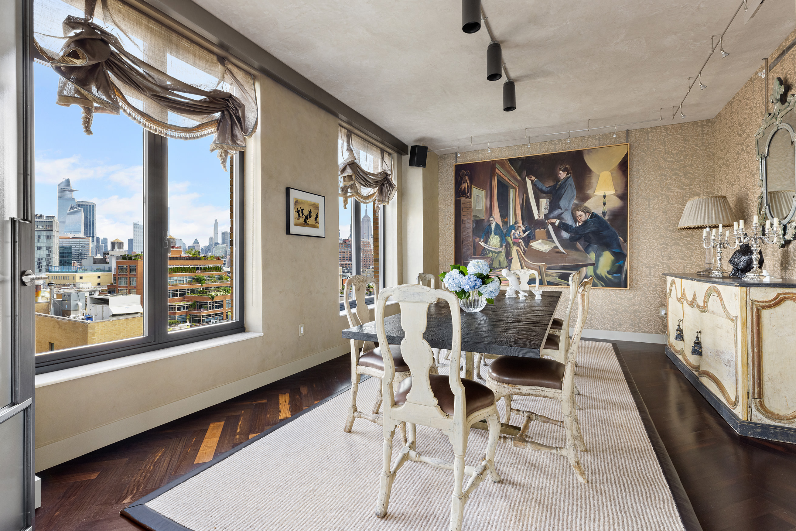 400 West 12th Street, Unit 12C Manhattan, NY 10014 - Photo 6 of 24 a view of a dining room with furniture window and wooden floor