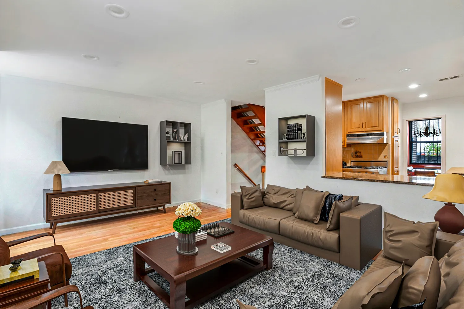 a living room with furniture and a flat screen tv