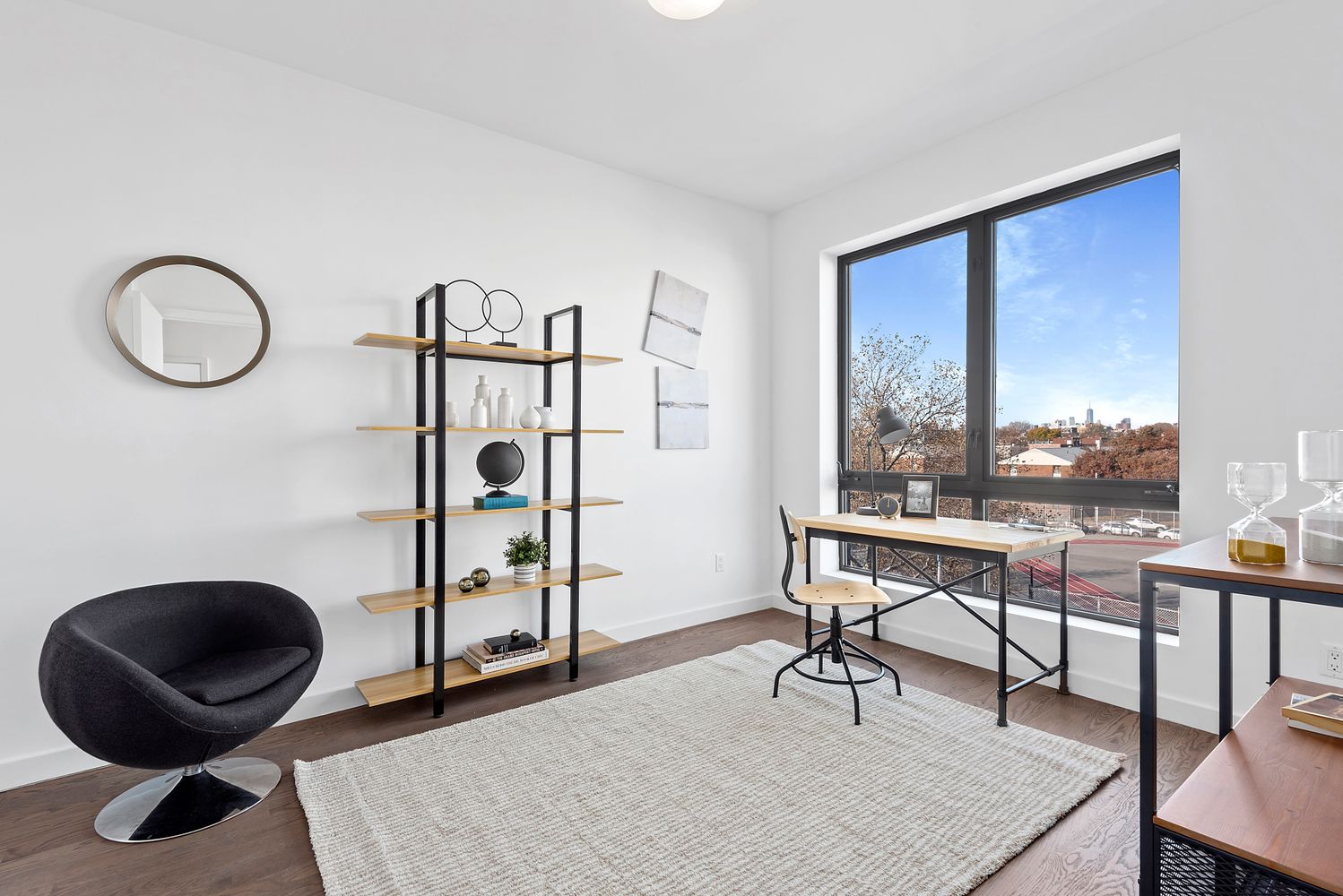 116 Covert Street, Unit 4A Brooklyn, NY 11207 - Photo 4 of 7 a view of a livingroom with furniture and a potted plant