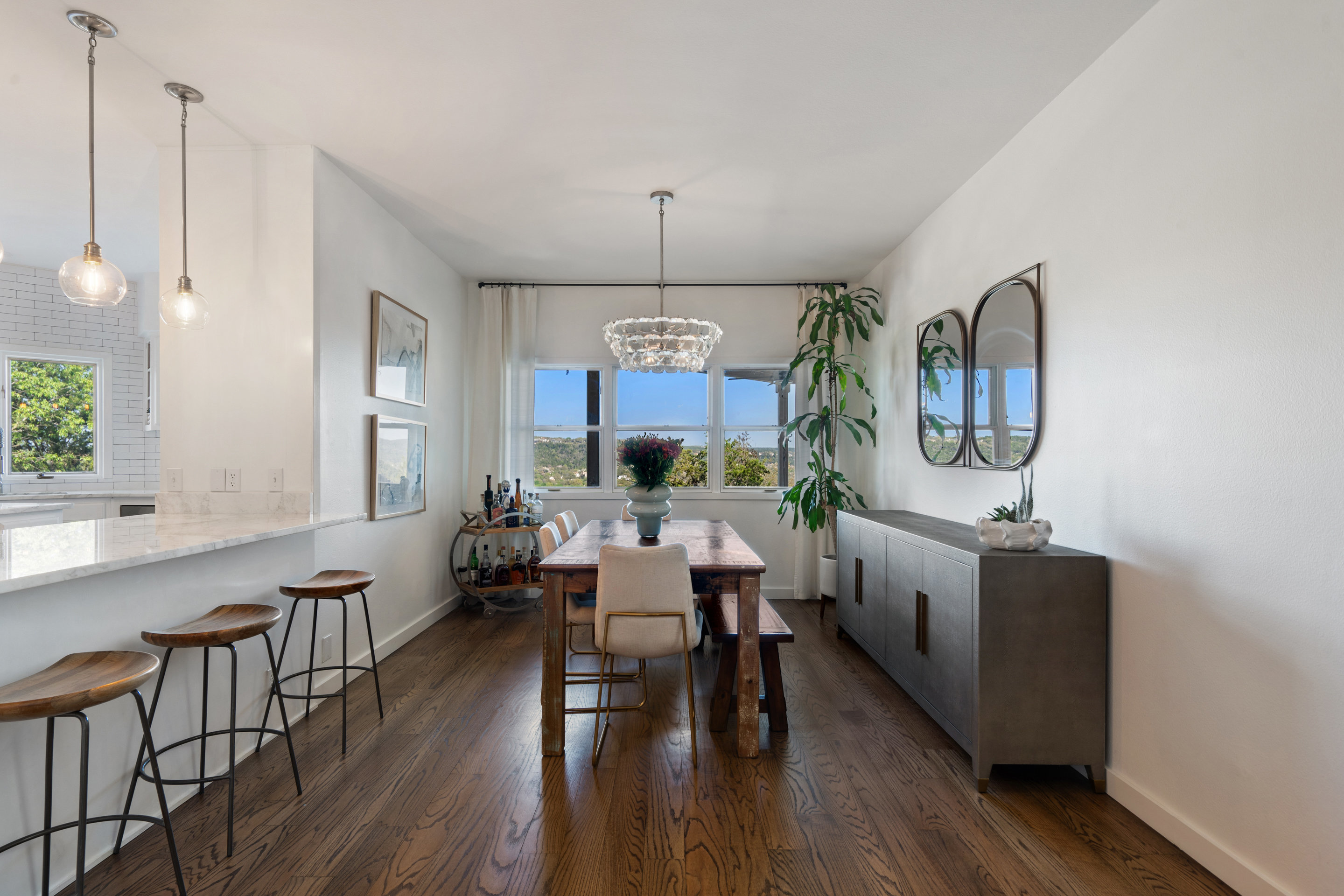 5319 Backtrail Drive Austin, TX 78731 - Photo 19 of 35 a view of a dining room with furniture window and wooden floor
