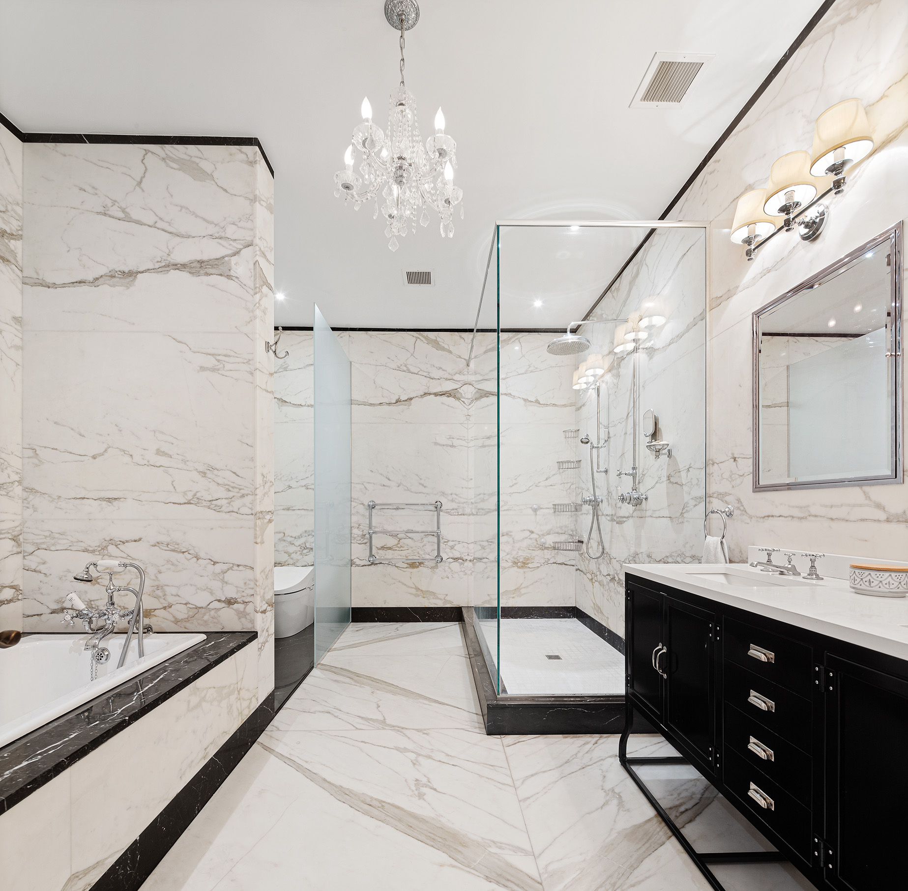 73 Wooster Street, Unit PHA Manhattan, NY 10012 - Photo 13 of 25 a spacious bathroom with a tub sink shower and mirror