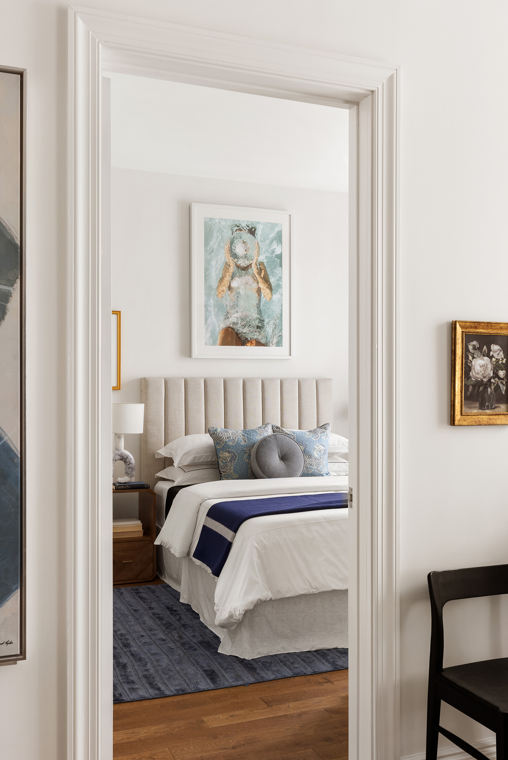 225 5th Avenue, Unit 6T Manhattan, NY 10010 - Photo 5 of 12 a bedroom with a bed and a painting on the wall