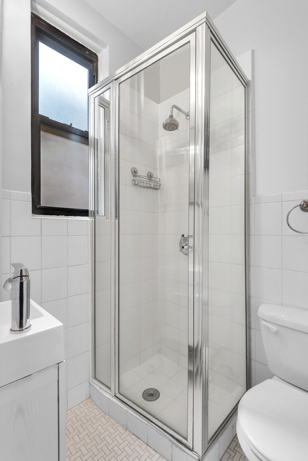 215 West 98th Street, Unit 8F Manhattan, NY 10025 - Photo 11 of 16 a bathroom with a shower and toilet