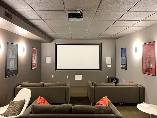 315 Gates Avenue, Unit 3H Brooklyn, NY 11216 - Photo 9 of 12 a living room with furniture and a flat screen tv