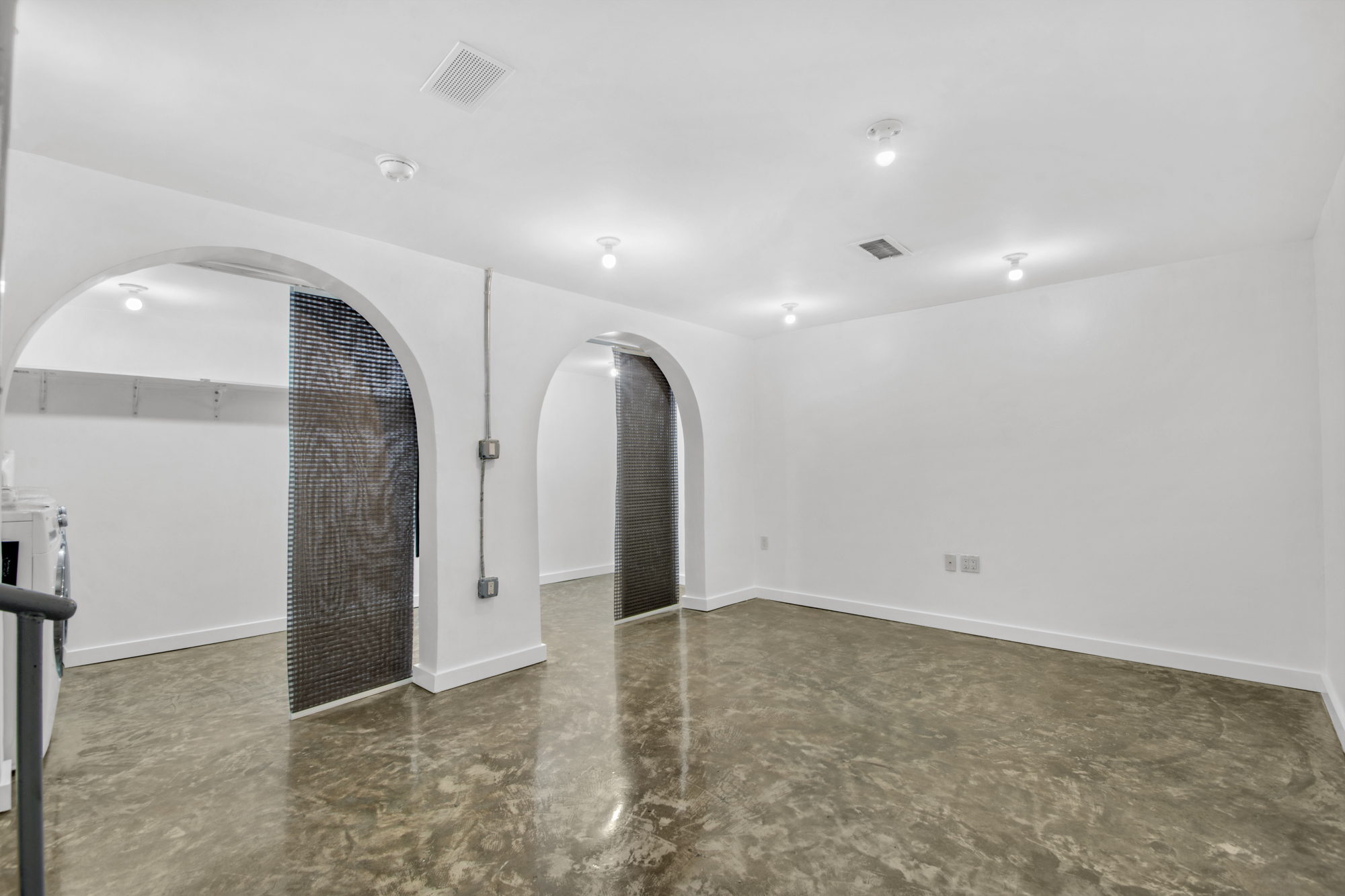 435 Putnam Avenue, Unit GARDEN Brooklyn, NY 11221 - Photo 7 of 11 an empty room with closet and mirrors