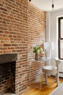 a brick wall with a fireplace