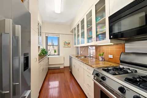 a kitchen with a stove and a refrigerator