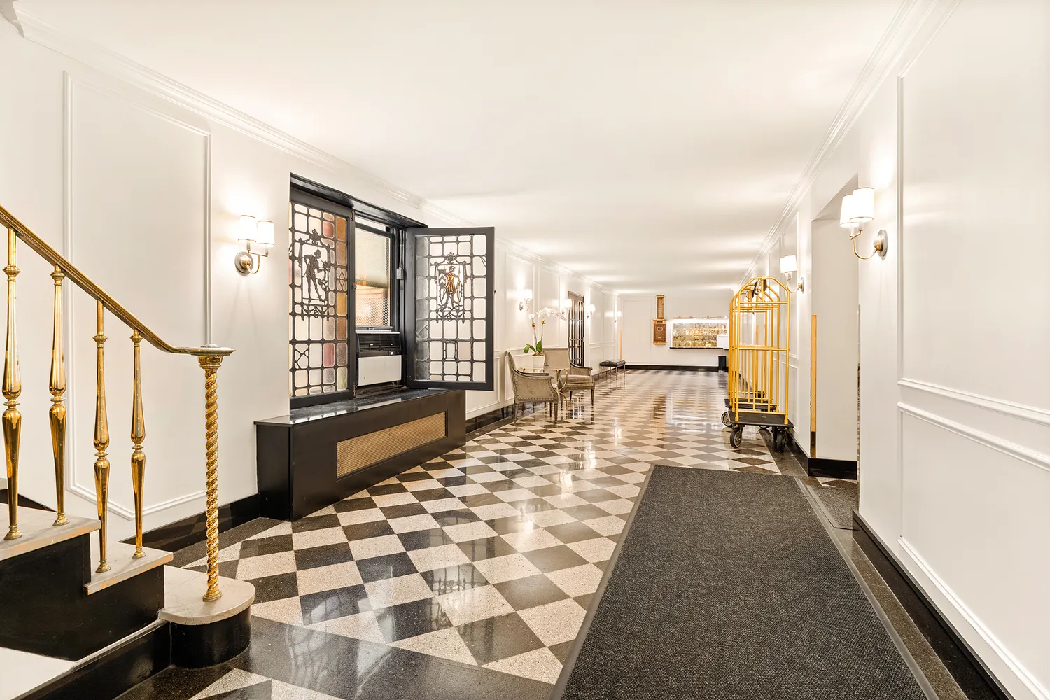 a large white living room with a large window