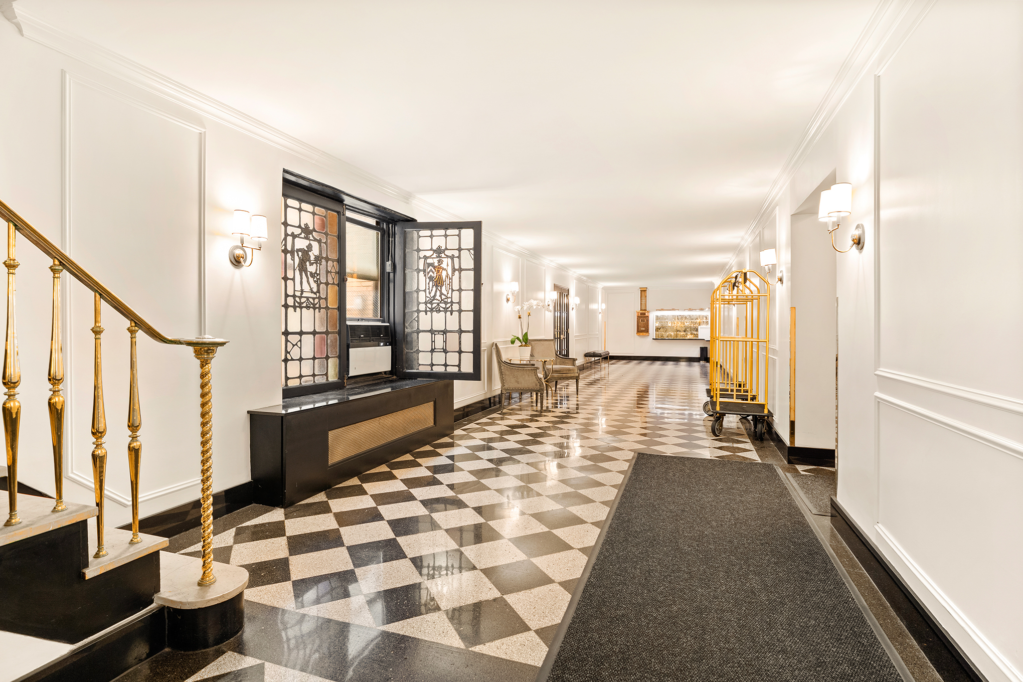 1435 Lexington Avenue, Unit 10C Manhattan, NY 10128 - Photo 9 of 12 a large white living room with a large window