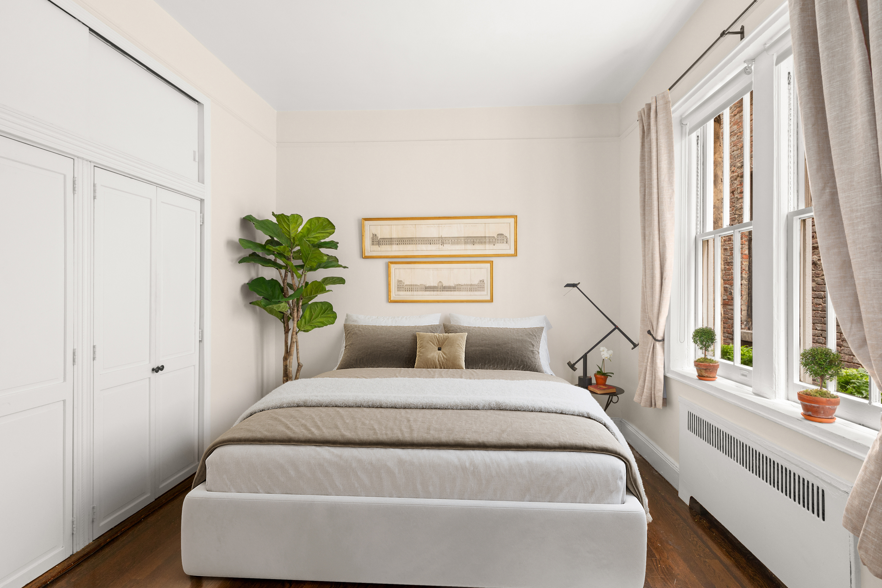 51 East 78th Street, Unit 3BC Manhattan, NY 10075 - Photo 12 of 25 a bedroom with a bed and a window