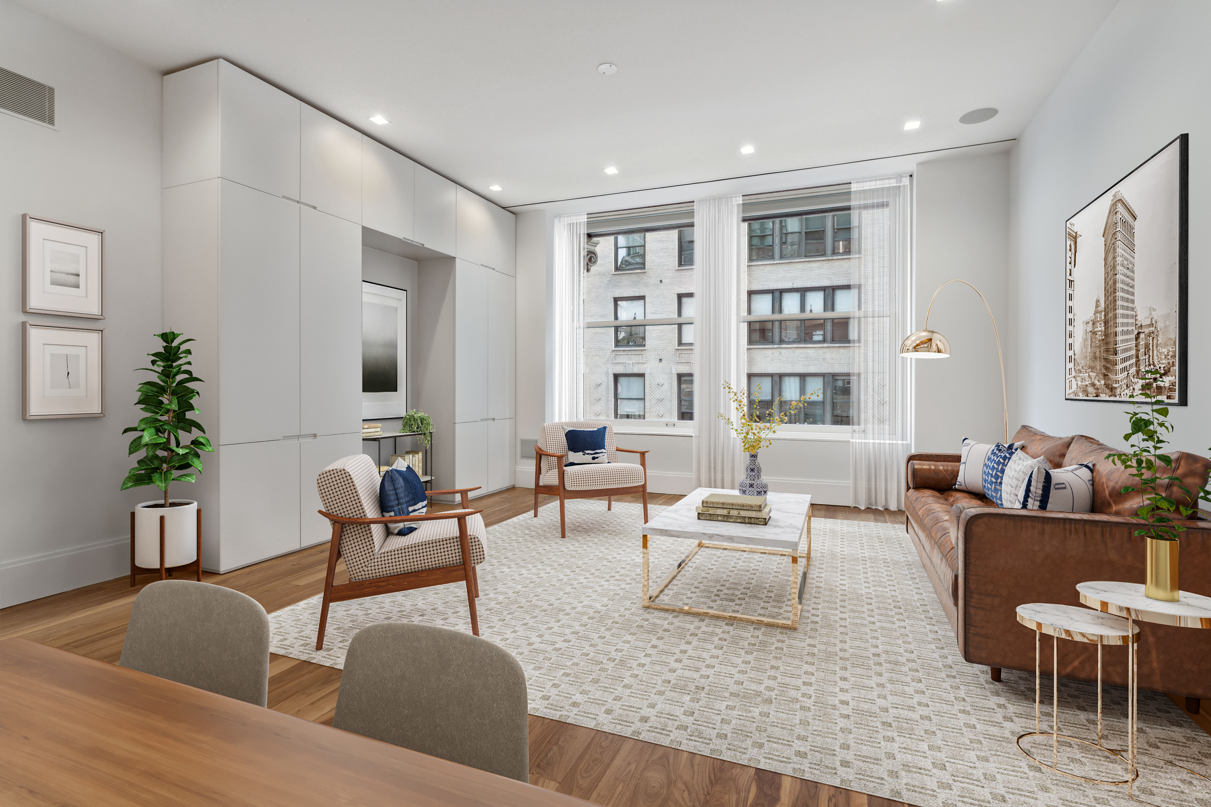 a living room with furniture and a potted plant
