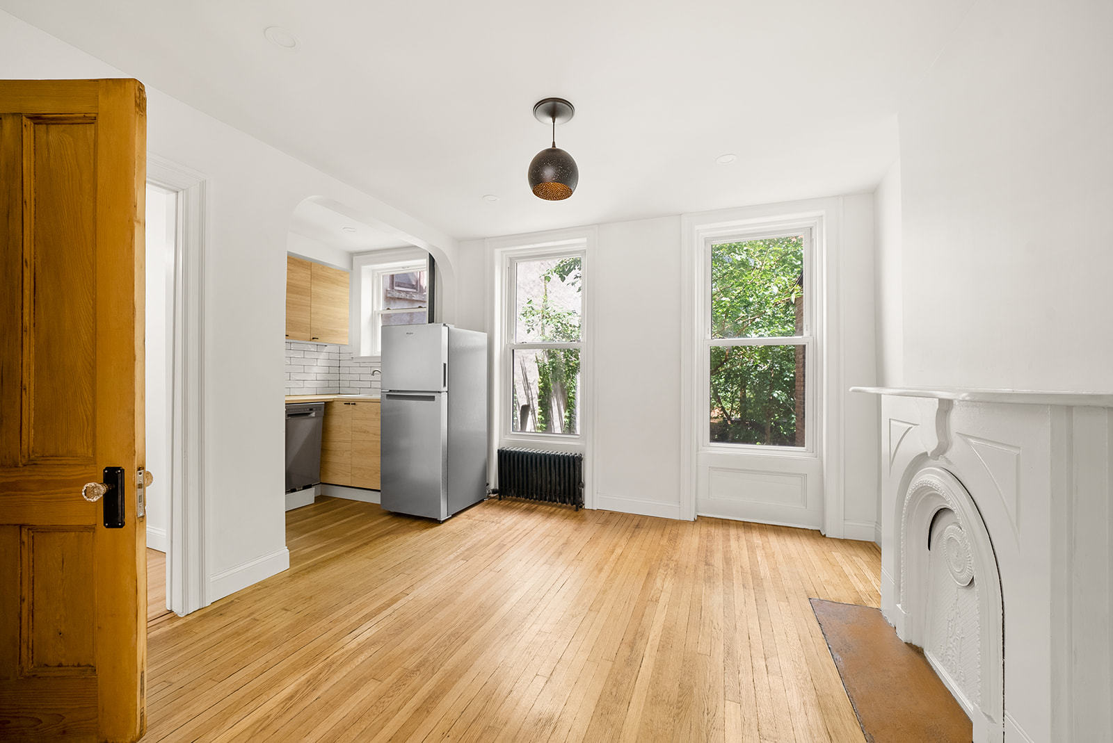 211 12th Street, Unit 2 Brooklyn, NY 11215 - Photo 2 of 7 a view of livingroom with hardwood floor and a window