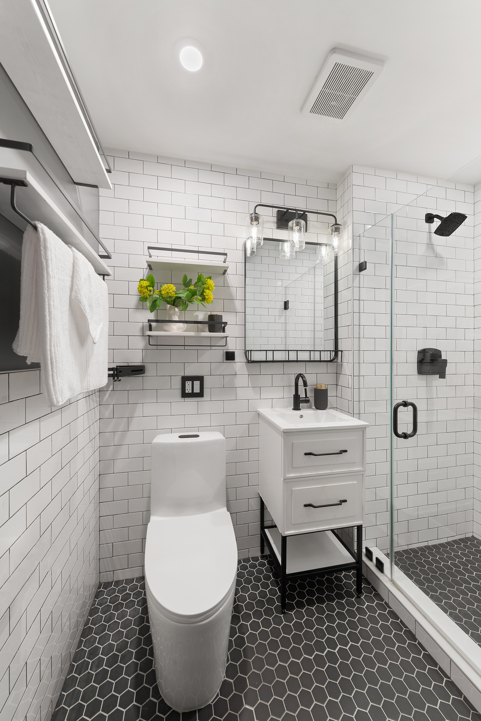 113 Prospect Park Southwest, Unit 12 Brooklyn, NY 11218 - Photo 9 of 13 a bathroom with a sink toilet and shower