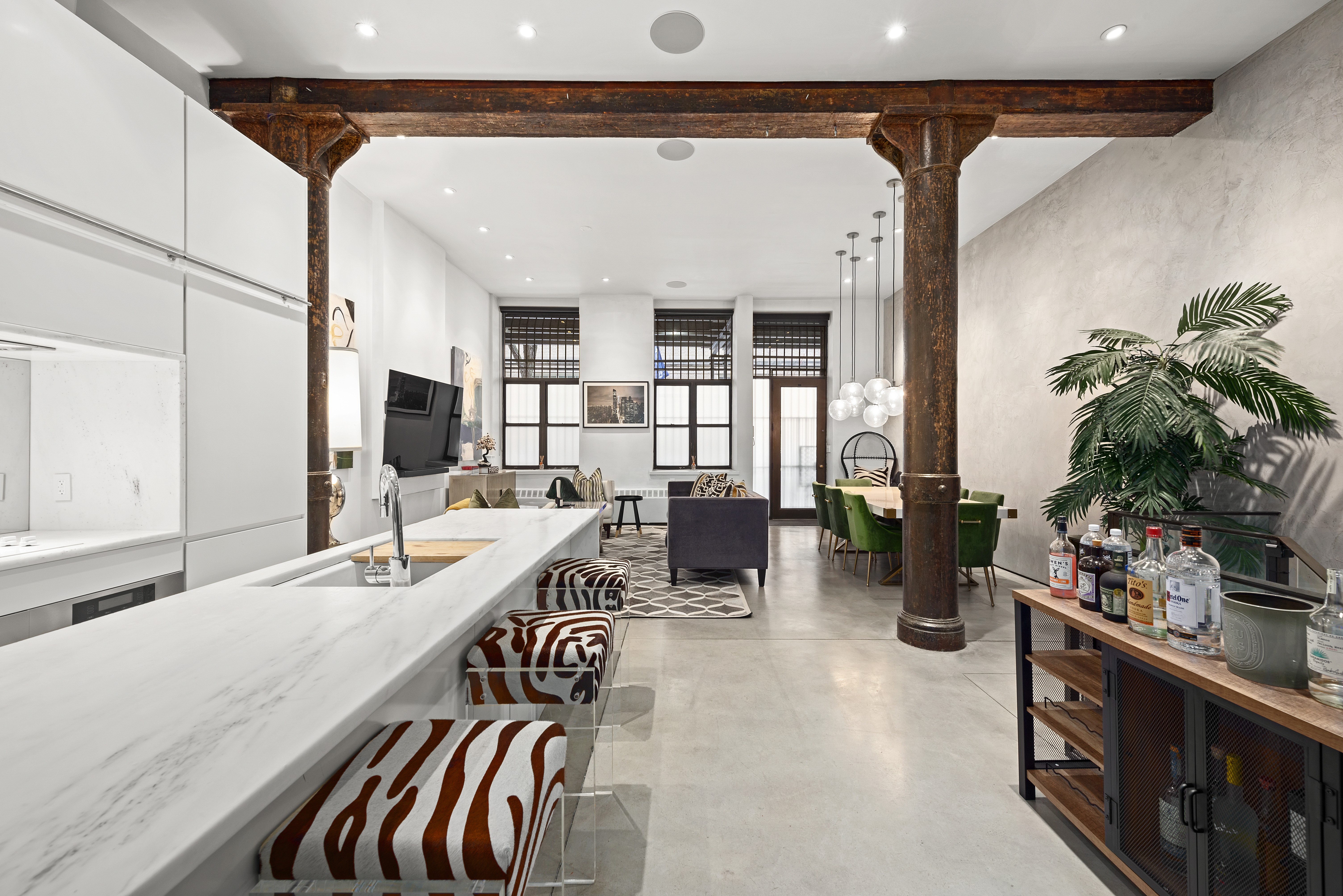 10 Bleecker Street, Unit 1B Manhattan, NY 10012 - Photo 3 of 16 a very nice looking living room with a large window and potted plants