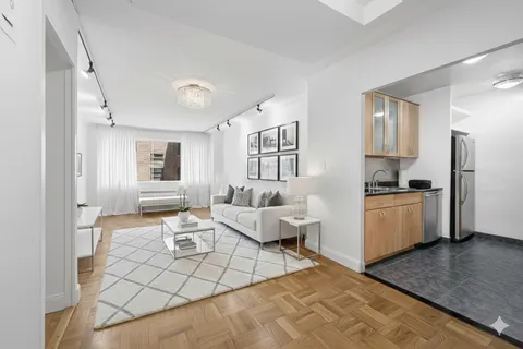 a living room with furniture and a window