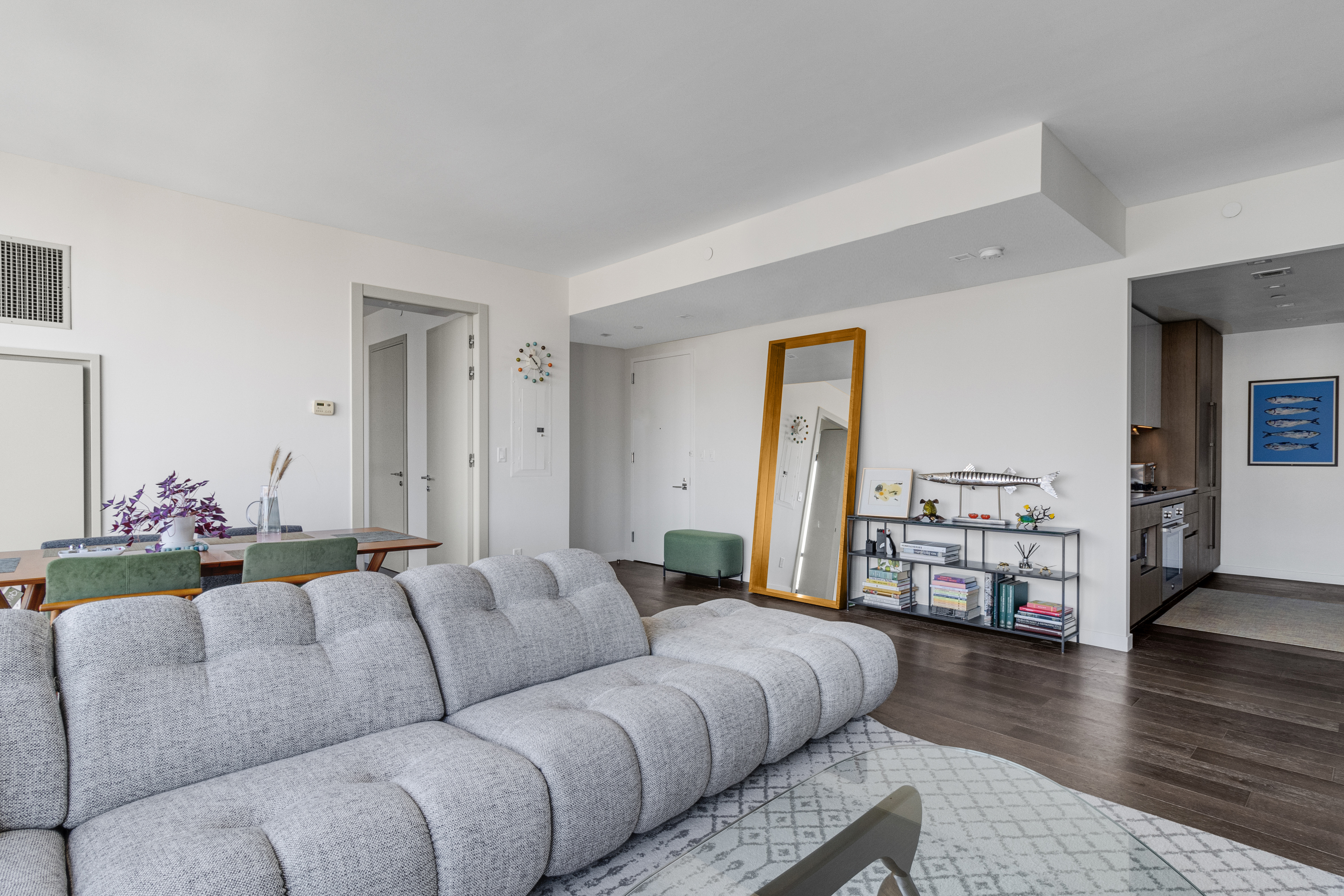 302 East 96th Street, Unit 1103 Manhattan, NY 10128 - Photo 3 of 22 a living room with furniture wooden floor and a table