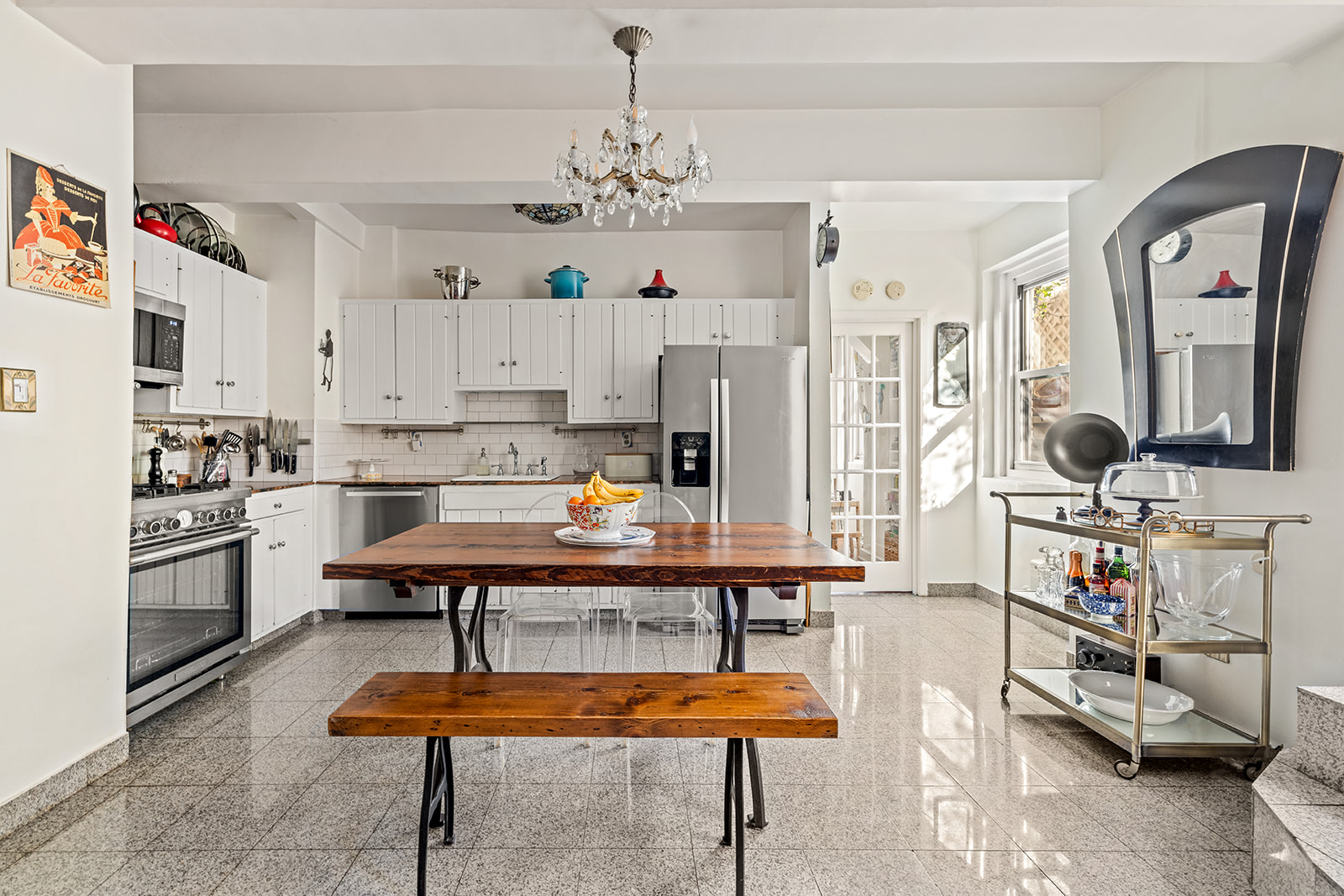 2166 Broadway, Unit 4C Manhattan, NY 10024 - Photo 5 of 10 a room with stainless steel appliances kitchen island granite countertop furniture and a kitchen view