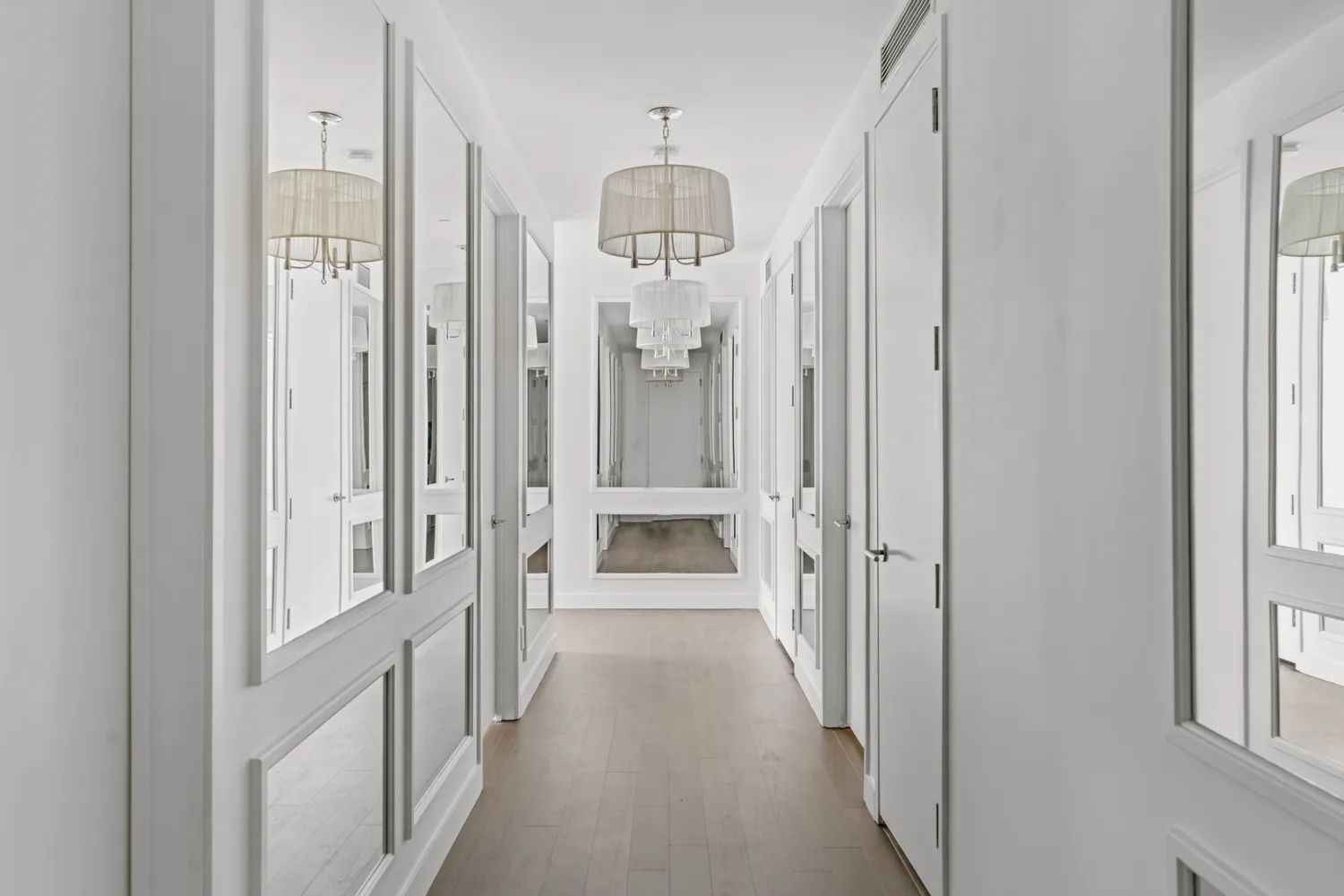 a view of a hallway with a chandelier
